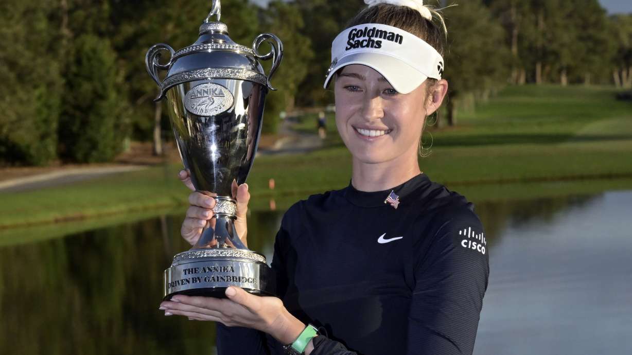 Nelly Korda holds the championship trophy after winning the the LPGA Annika golf tournament at Pelican Golf Club, Sunday, Nov. 17, 2024, in Belleair, Fla.