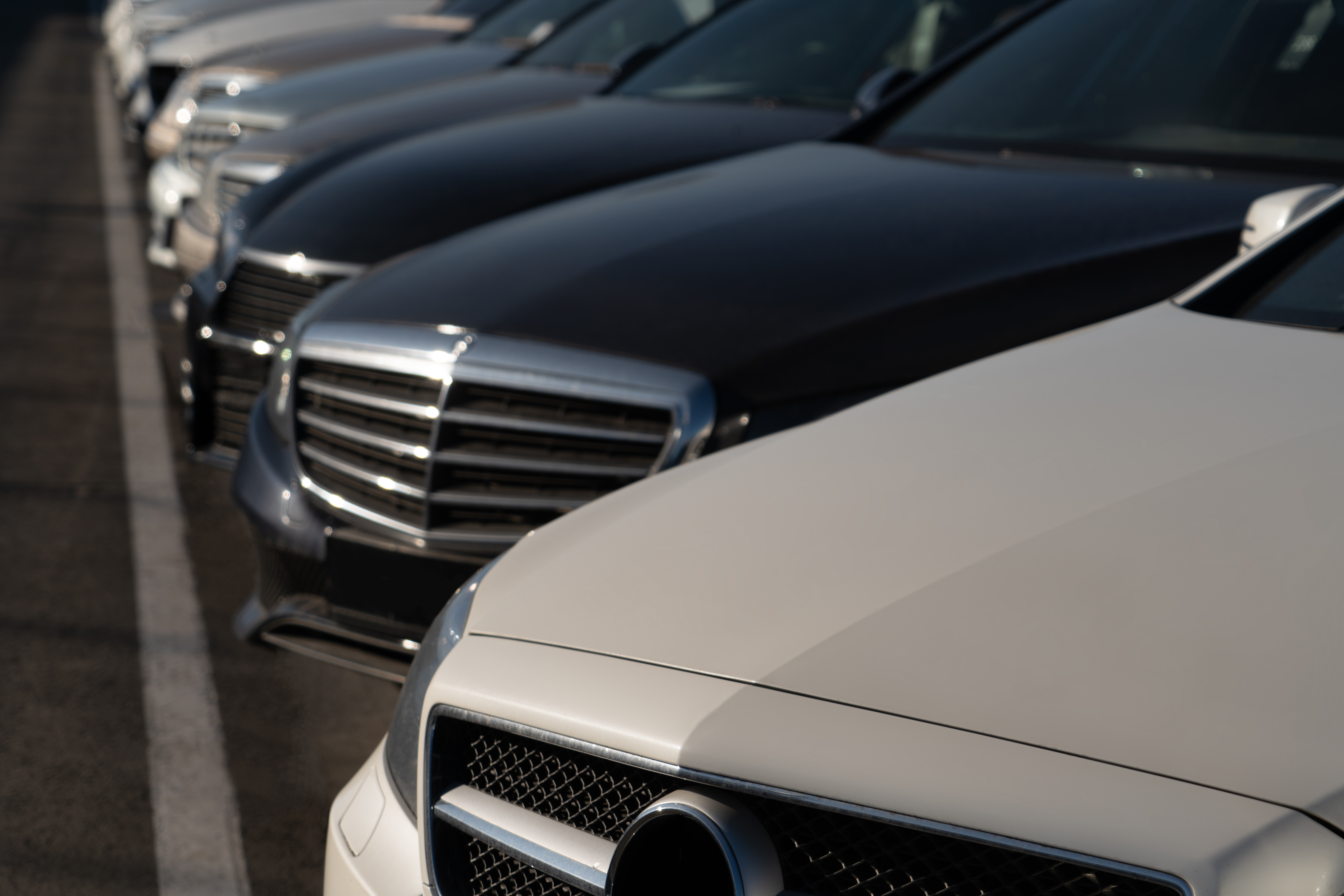 The owner of a now-closed Salt Lake car dealership is charged with failing to deliver titles on vehicles purchased by customers because he still owed money to companies that gave him loans.