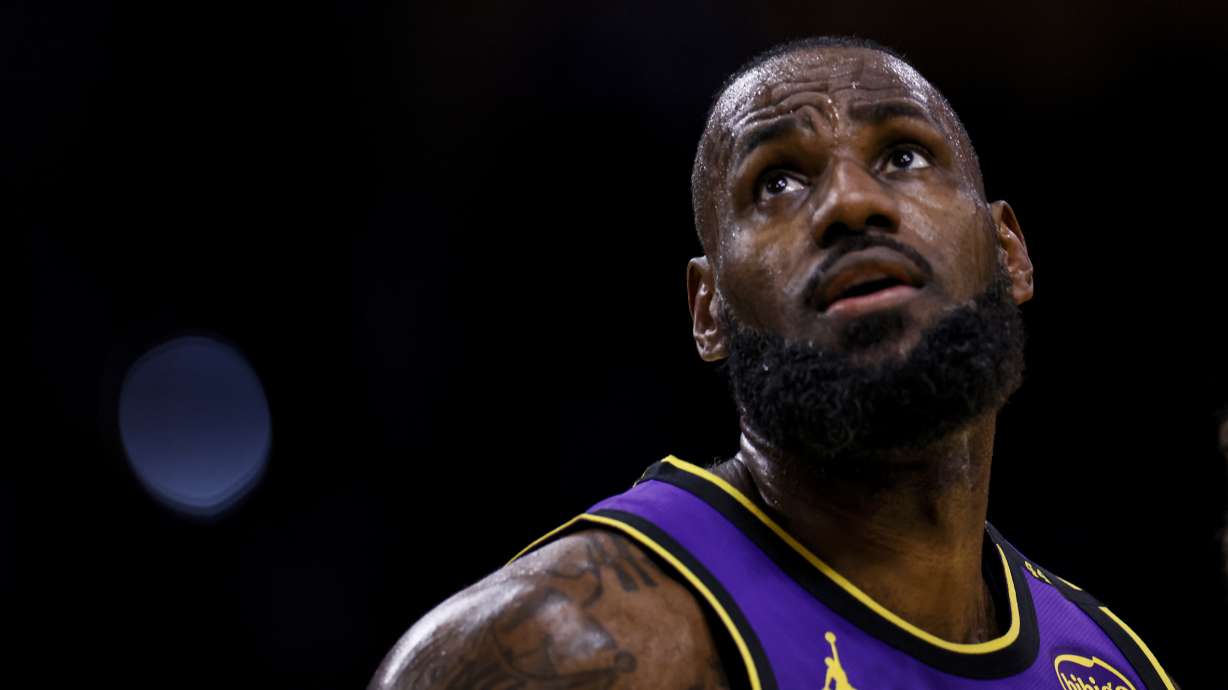 Los Angeles Lakers forward LeBron James reacts during the first half of an Emirates NBA Cup basketball game against the Utah Jazz, Tuesday, Nov. 19, 2024, in Los Angeles.