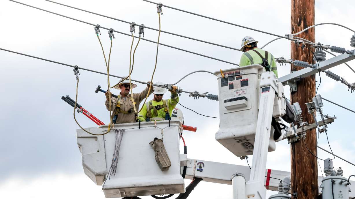 Rocky Mountain Power responds after a construction crane hit power lines in Salt Lake City on Aug. 1, 2023. Utah GOP legislative leaders and Gov. Spencer Cox are pushing Rocky Mountain Power to divorce itself from PacifiCorp.