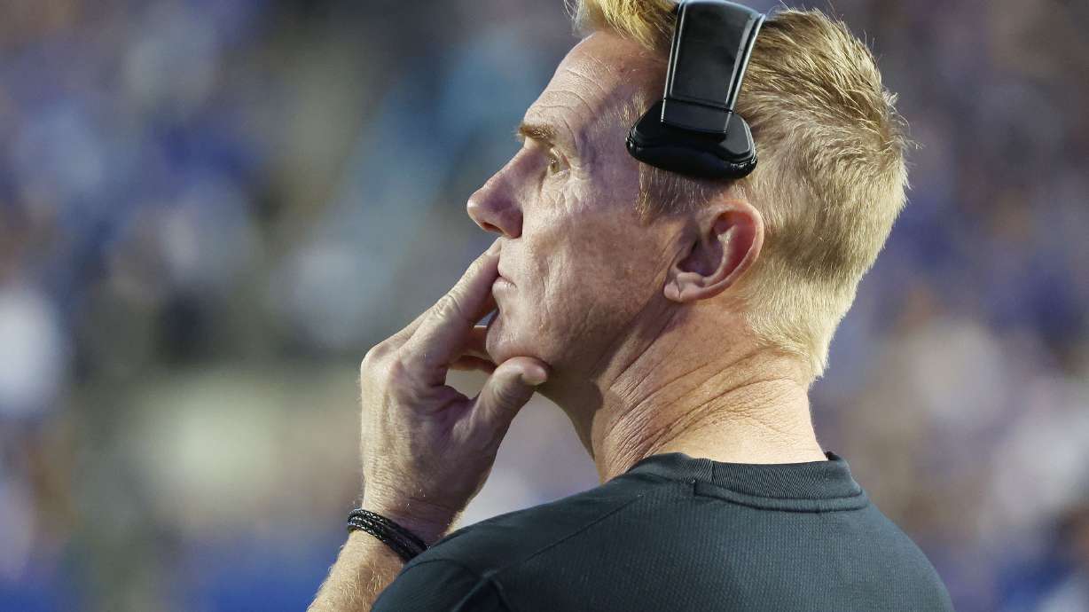 Utah State Aggies head coach Blake Anderson watches the game in Provo on Sept. 29, 2022. The football coach Blake Anderson and his former employer are once again in the legal spotlight after Anderson filed a $15 million wrongful termination lawsuit against the university and its athletic director on Tuesday.