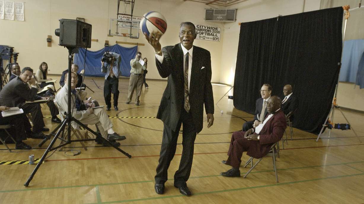 FILE - Former Chicago Bulls player and director of community affairs for the team, Bob Love, shows media members that he hasn't lost his touch with the ball after announcing his candidacy for Alderman in the cities 15th ward, Sept. 25, 2002, in Chicago.