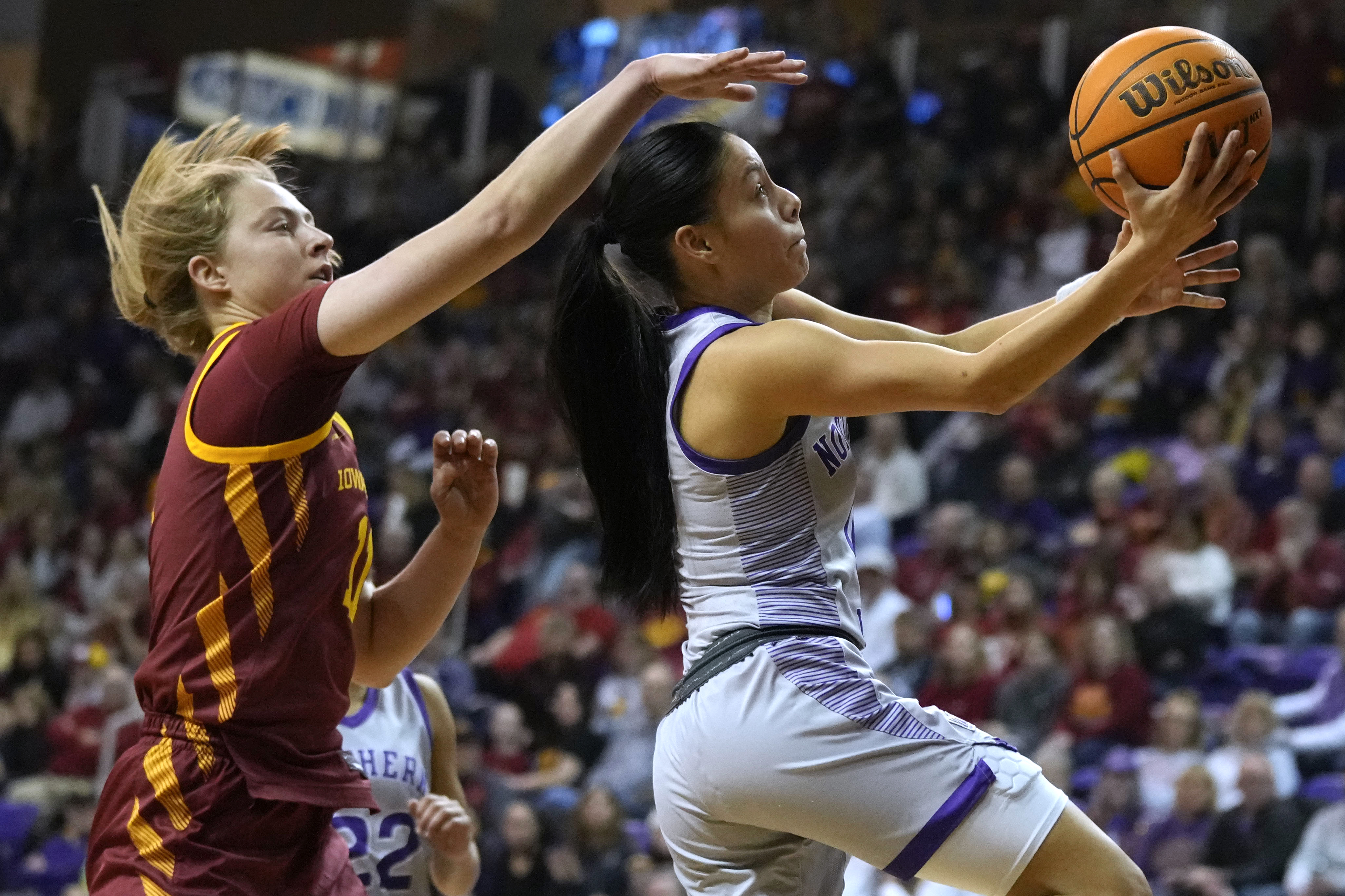 Northern Iowa guard Maya McDermott drives to the basket past Iowa State guard Emily Ryan, left, during the second half of an NCAA college basketball game, Wednesday, Nov. 20, 2024, in Cedar Falls, Iowa. 