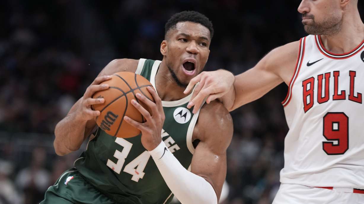 Milwaukee Bucks' Giannis Antetokounmpo drives on Chicago Bulls' Nikola Vucevic during the second half of an NBA basketball game Wednesday, Nov. 20, 2024, in Milwaukee. Tyhe Bucks won 122-106.