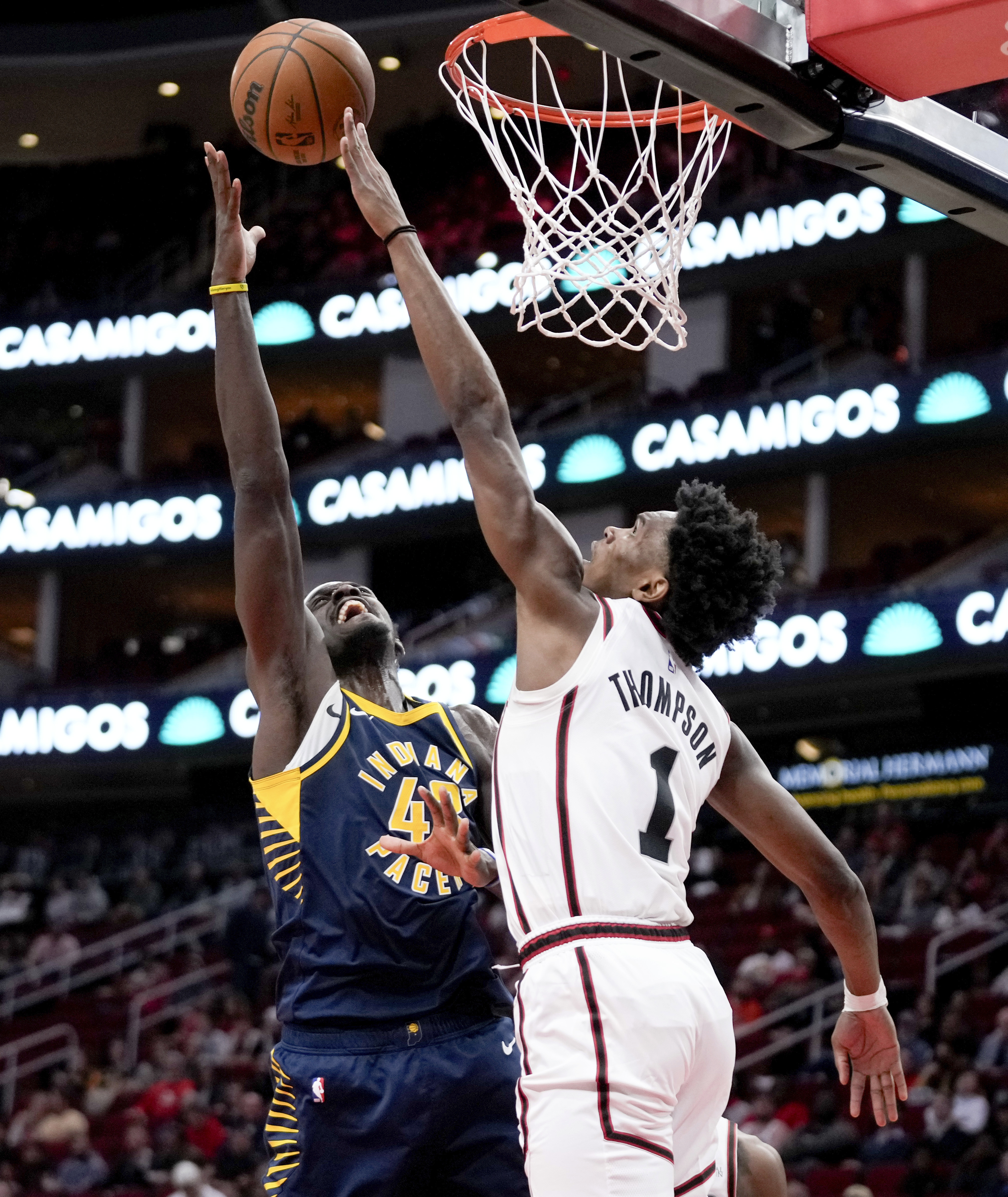 Indiana Pacers forward Pascal Siakam, left, shoots as Houston Rockets forward Amen Thompson defends during the first half of an NBA basketball game Wednesday, Nov. 20, 2024, in Houston.