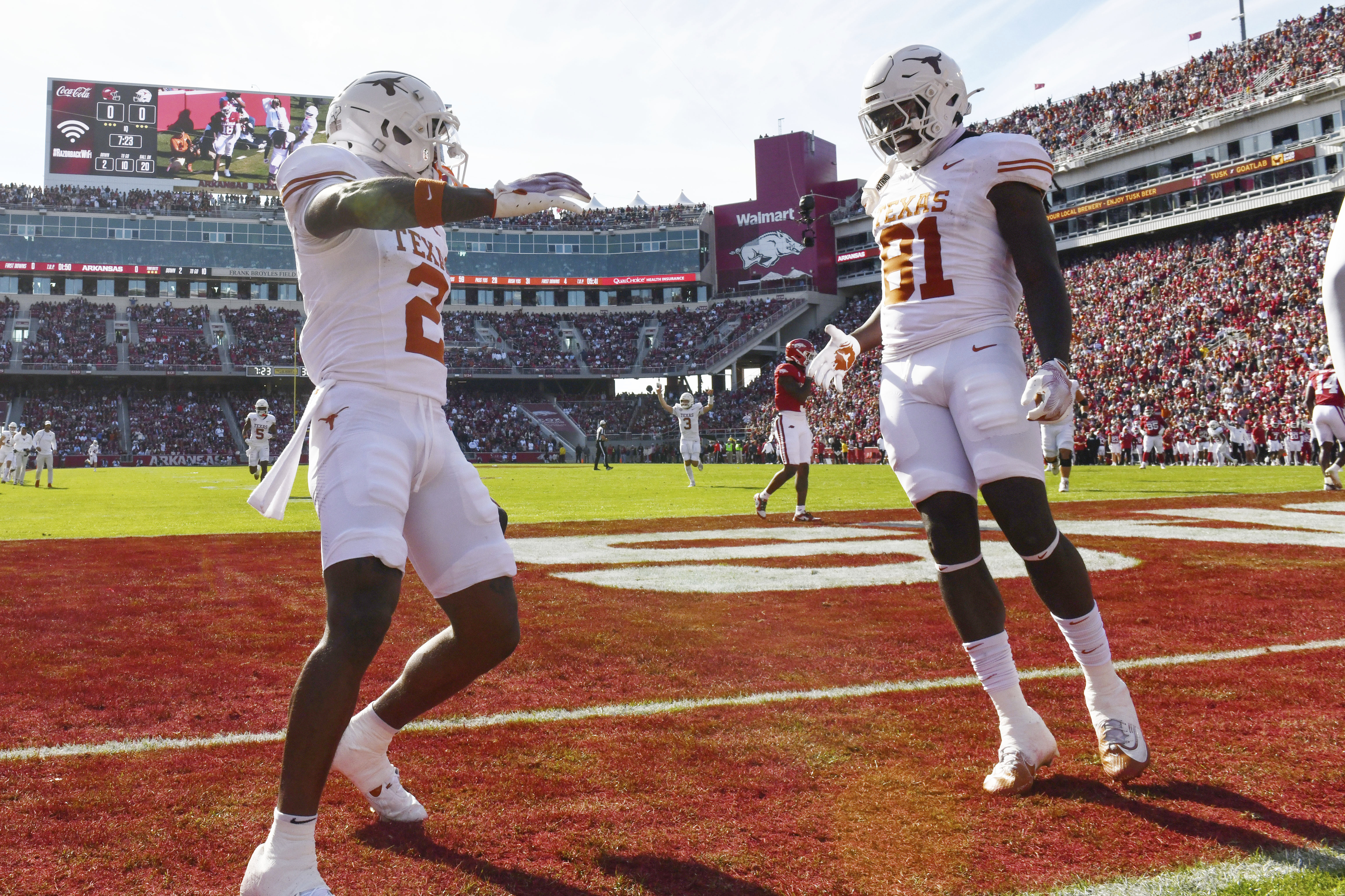 Texas wide receiver Matthew Golden (2) celebrates with teammate Juan Davis (81) after making a touchdown catch against Arkansas during the first half of an NCAA college football game Saturday, Nov. 16, 2024, in Fayetteville, Ark. 