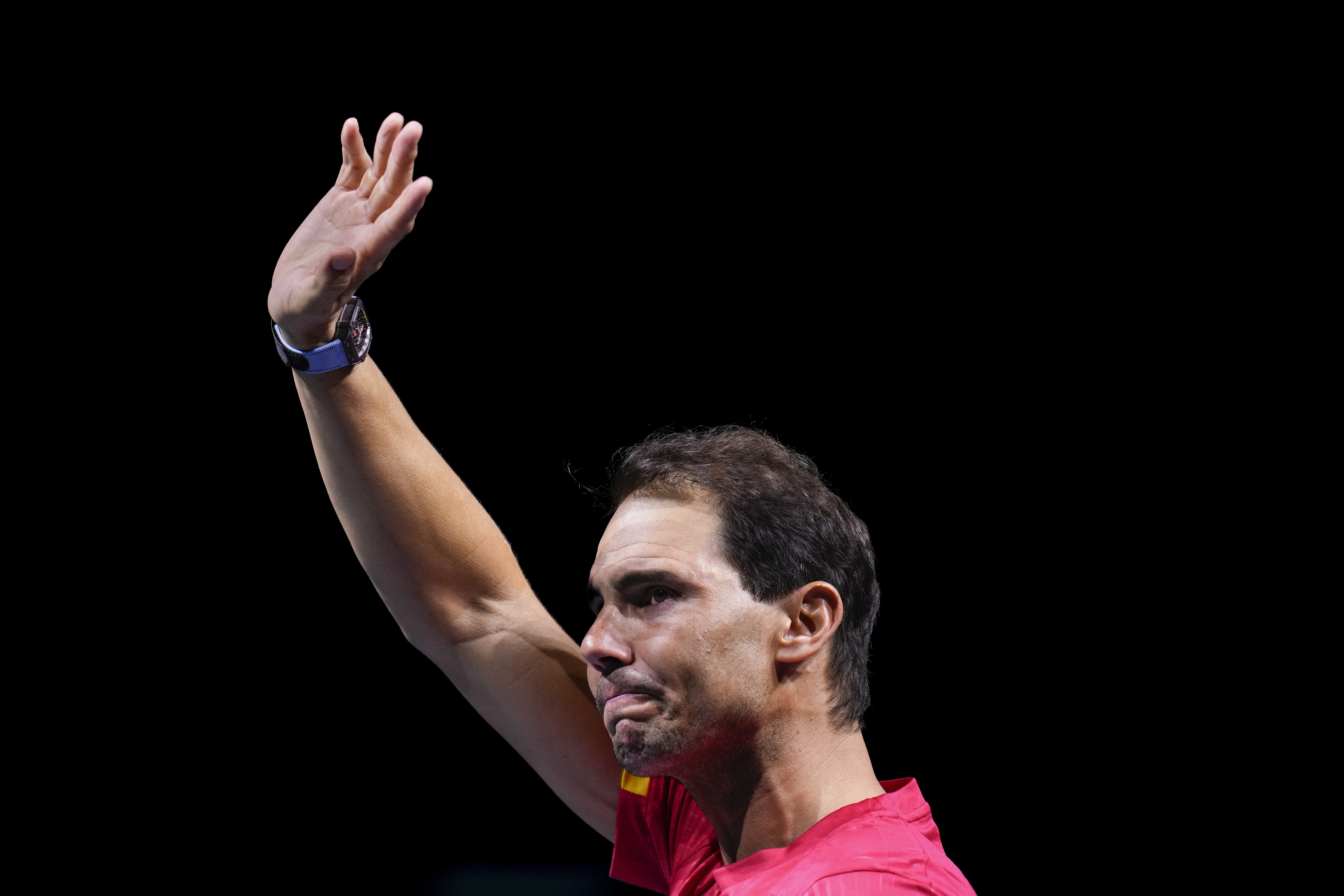 Spain's Rafael Nadal waves to the crowd during a tribute after playing his last match as a professional tennis player in the Davis Cup quarterfinals at the Martin Carpena Sports Hall in Malaga, southern Spain, on early Wednesday, Nov. 20, 2024.