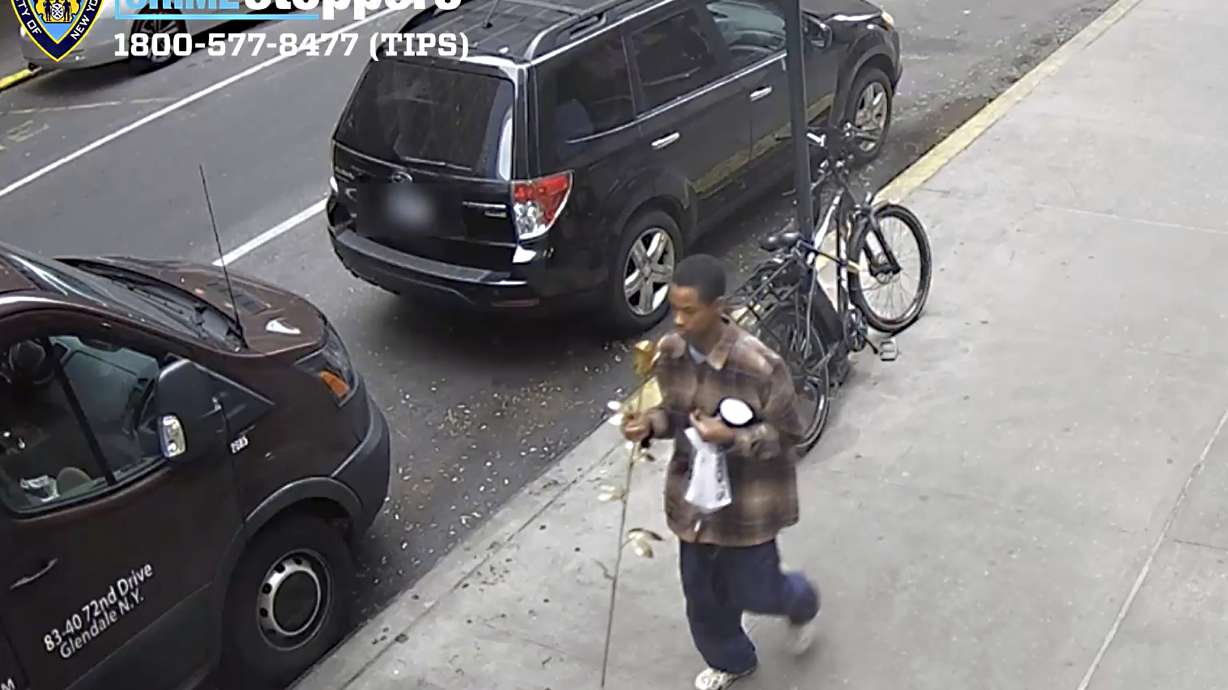 This image from surveillance video provided by the New York City Police Department shows a man accused of stealing a gold-plated metal rose from the Church of St. Francis of Assisi memorial honoring the victims of 9/11 on Wednesday in New York.