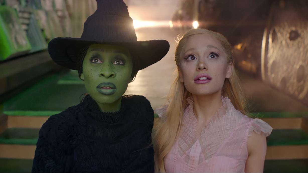 Cynthia Erivo and Ariana Grande in a scene from the film "Wicked," which opened in theaters this week.
