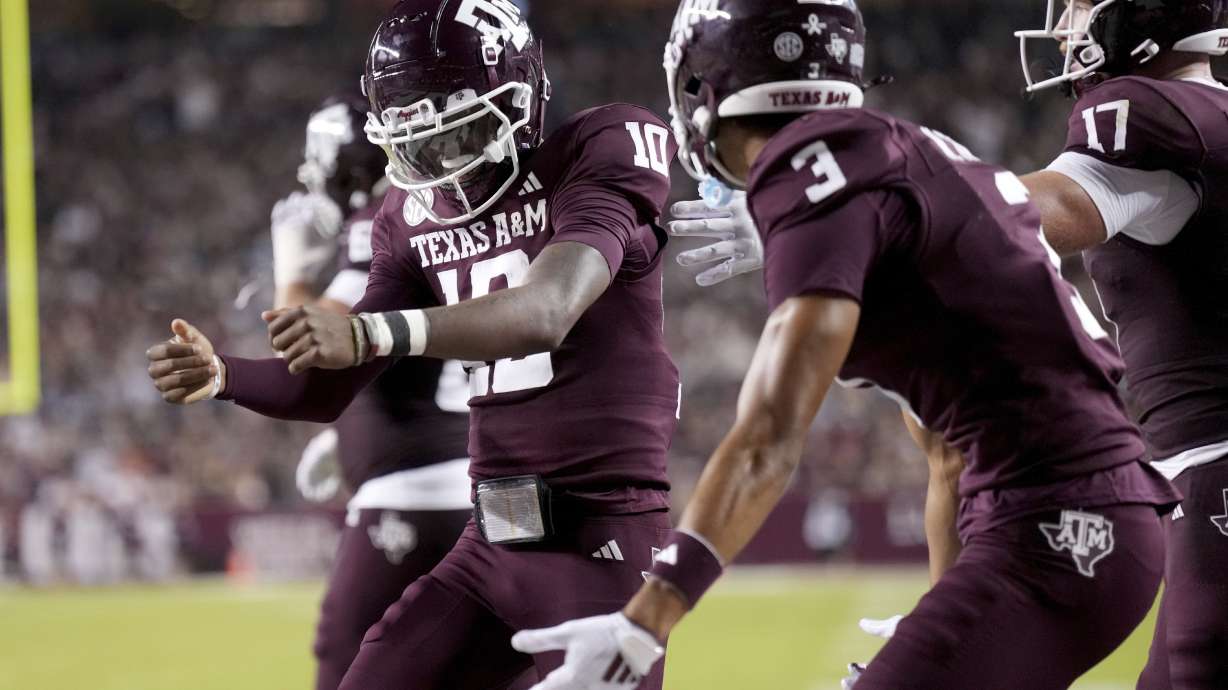 Texas A&M quarterback Marcel Reed (10) reacts near teammate Noah Thomas (3) after scoring a rushing touchdown against New Mexico State during the second half of an NCAA college football game Saturday, Nov. 16, 2024, in College Station, Texas.
