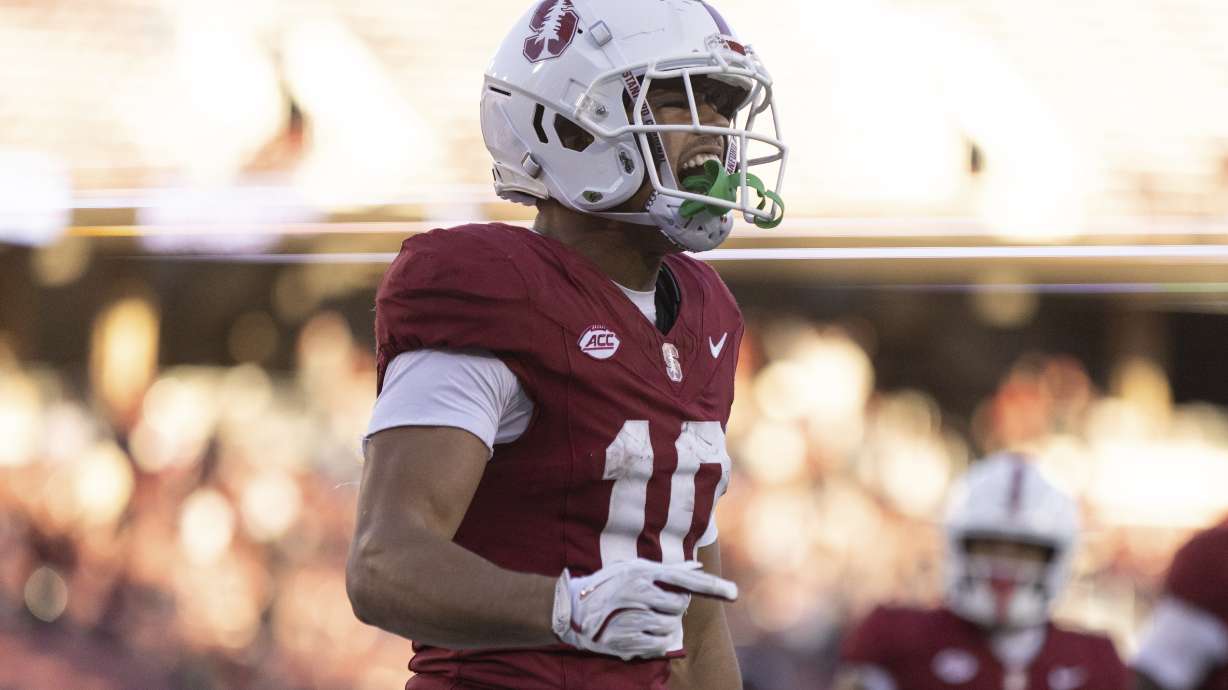Stanford wide receiver Emmett Mosley V (10) celebrates after scoring a touchdown to tie the game against Louisville during the second half of an NCAA college football game in Stanford, Calif., Saturday, Nov. 16, 2024. Stanford won 38-35.