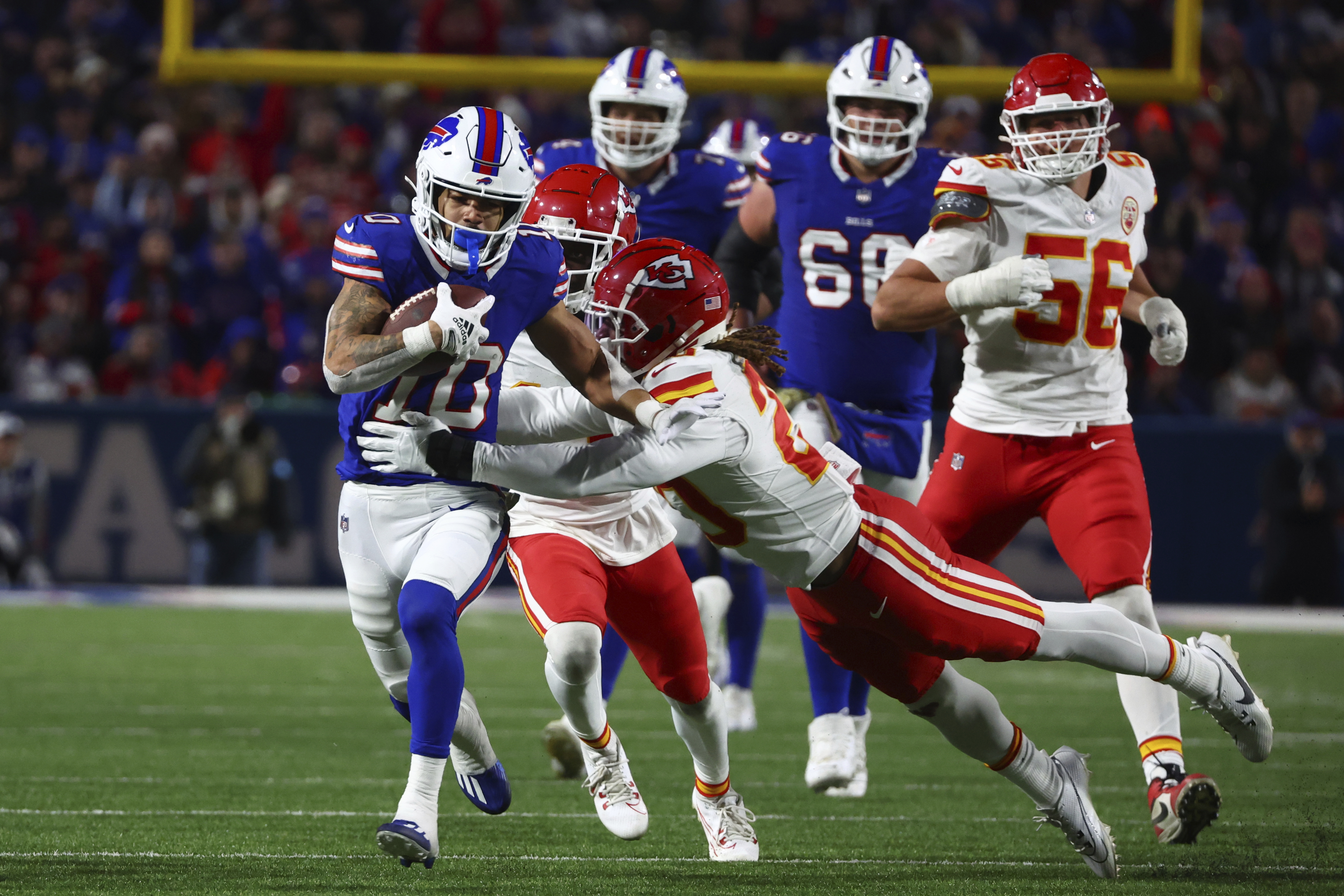 Buffalo Bills wide receiver Khalil Shakir (10) runs with the ball as Kansas City Chiefs' Justin Reid defends during the second half of an NFL football game Sunday, Nov. 17, 2024, in Orchard Park, N.Y. 