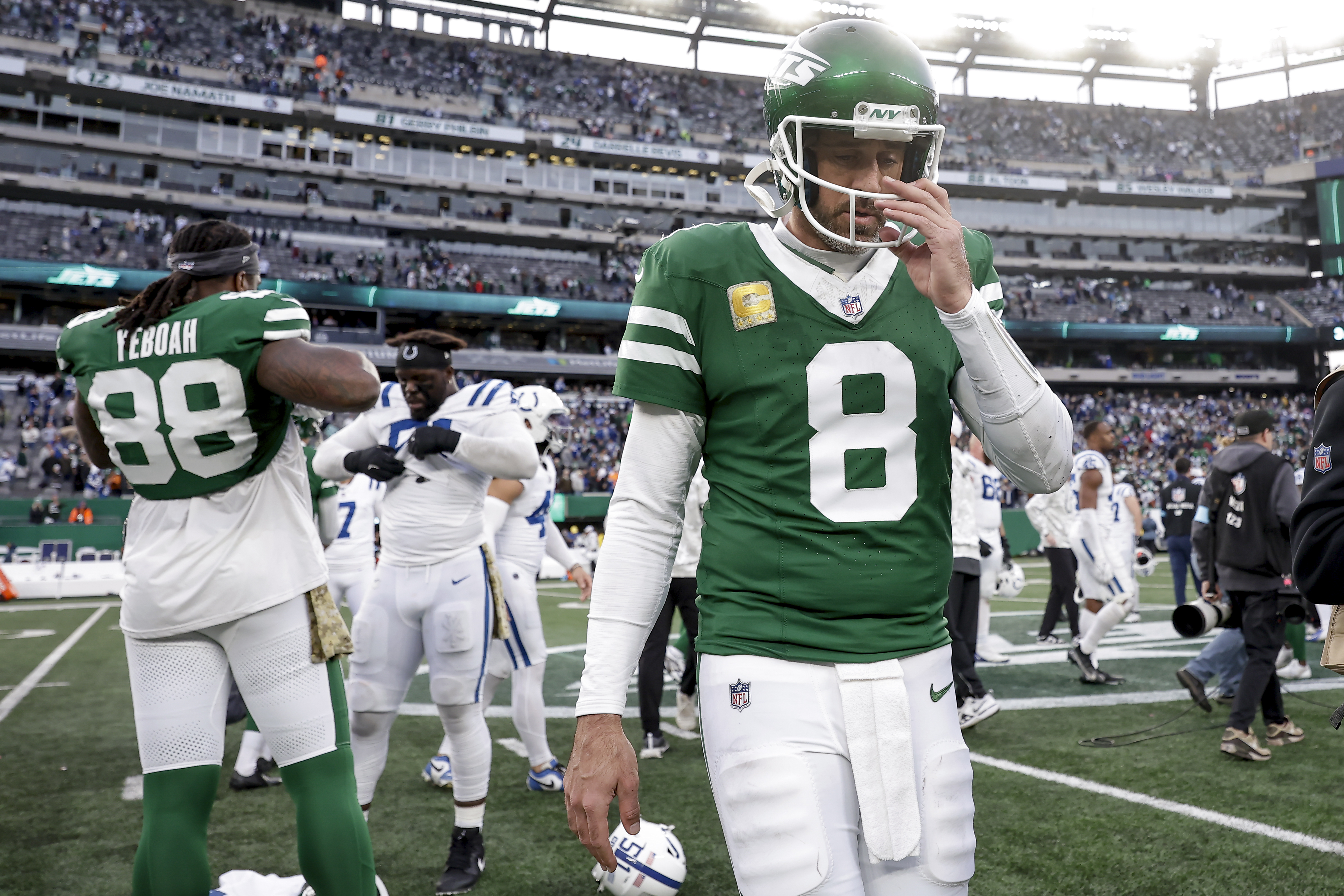New York Jets quarterback Aaron Rodgers (8) walks off the field after the Jets lost an NFL football game to the Indianapolis Colts, Sunday, Nov. 17, 2024, in East Rutherford, N.J. 