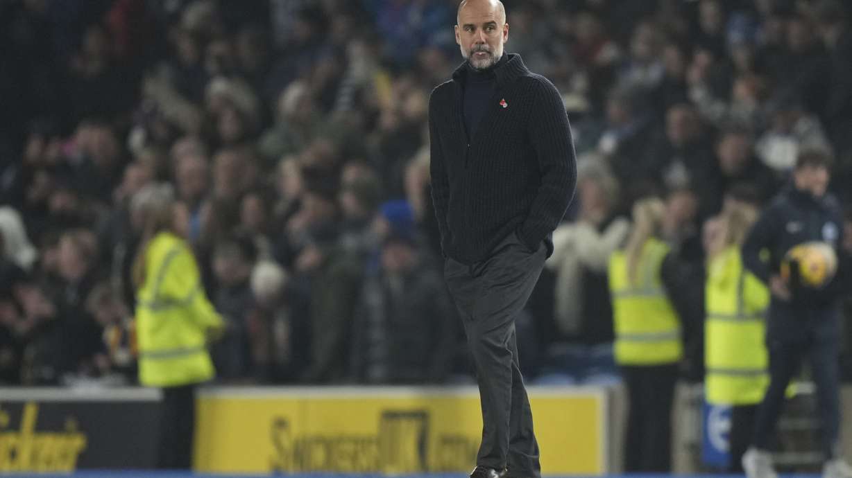 Manchester City's head coach Pep Guardiola leaves the pitch after the English Premier League soccer match between Brighton and Manchester City at Falmer Stadium in Brighton, England, Saturday, Nov. 9, 2024.