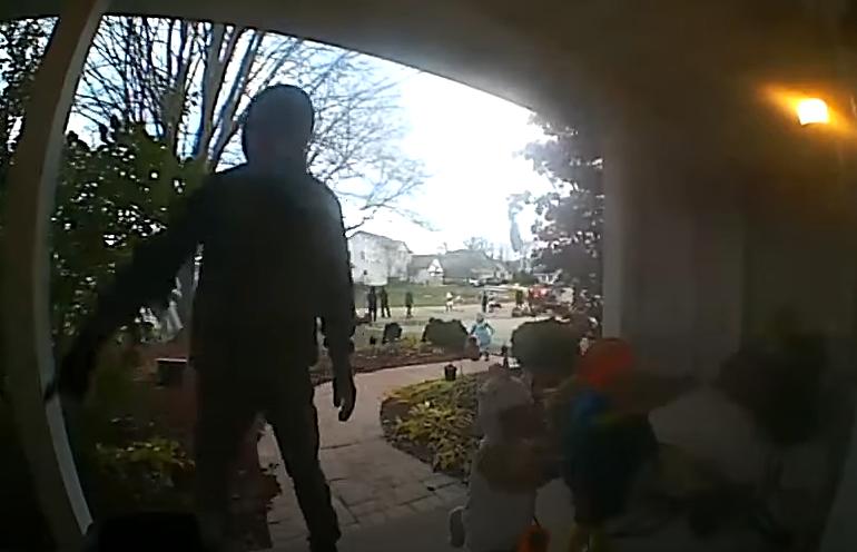 A dad gets spooked while trick-or-treating with his kids in Neenah, Wisconsin, on Halloween.