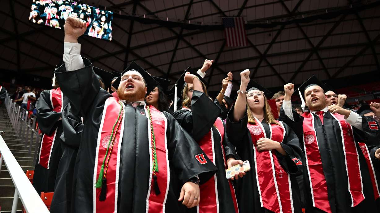 Graduates cheer after the marching band played after commencement at the University of Utah in Salt Lake City on May 2. Lawmakers are asking plenty of questions about how Utah will fund and prioritize higher education in the years to come.