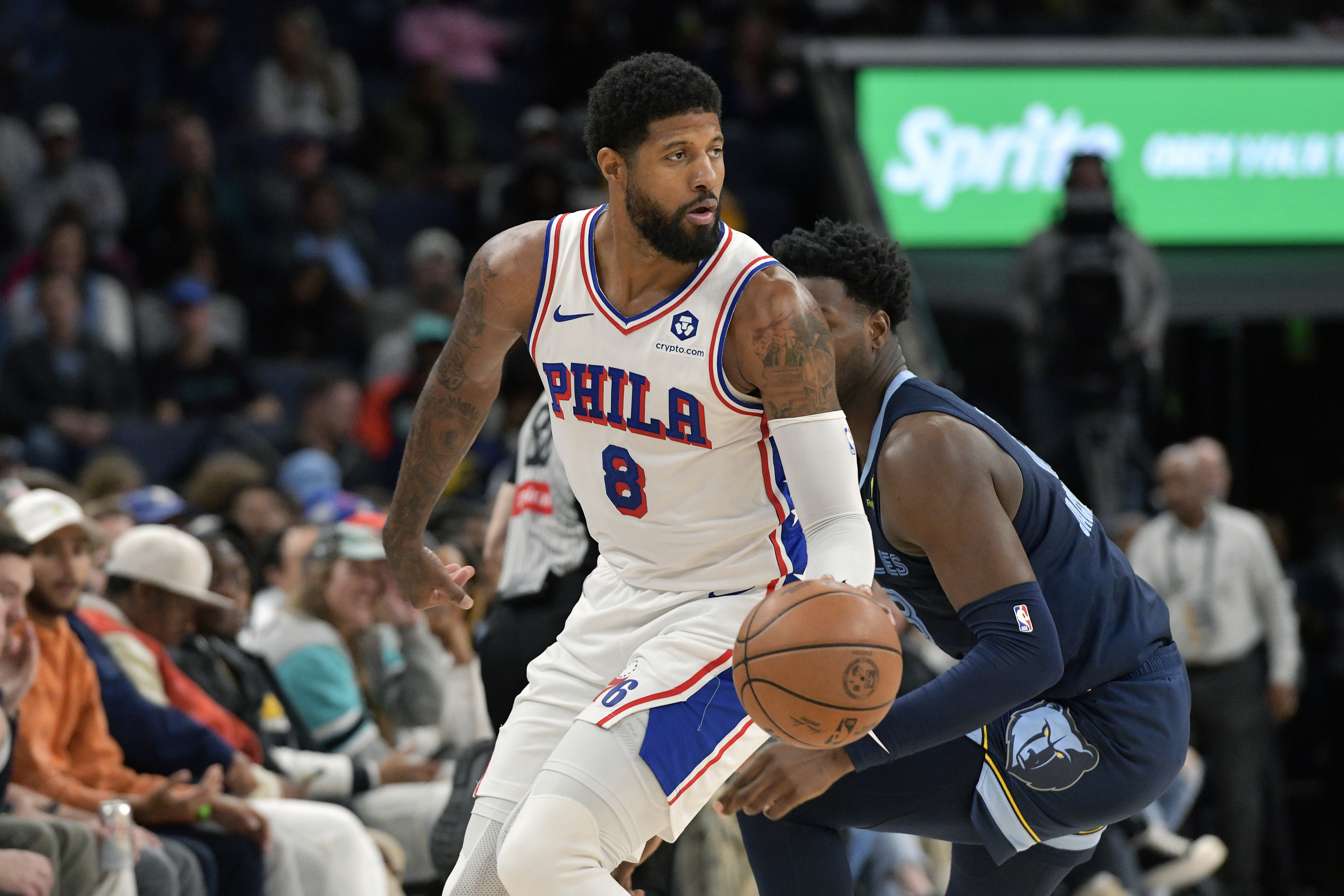 Philadelphia 76ers forward Paul George (8) handles the ball ahead of Memphis Grizzlies forward Jaren Jackson Jr. (13) in the first half of an NBA basketball game Wednesday, Nov. 20, 2024, in Memphis, Tenn. 