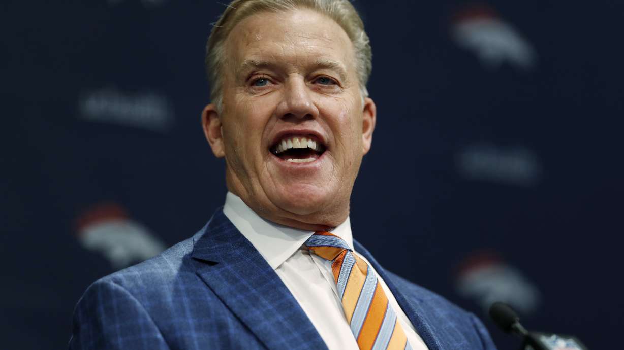 FILE - Denver Broncos general manager John Elway introduces the team's new head coach, Vic Fangio, during a news conference at the team's headquarters Thursday, Jan. 10, 2019, in Englewood, Colo.