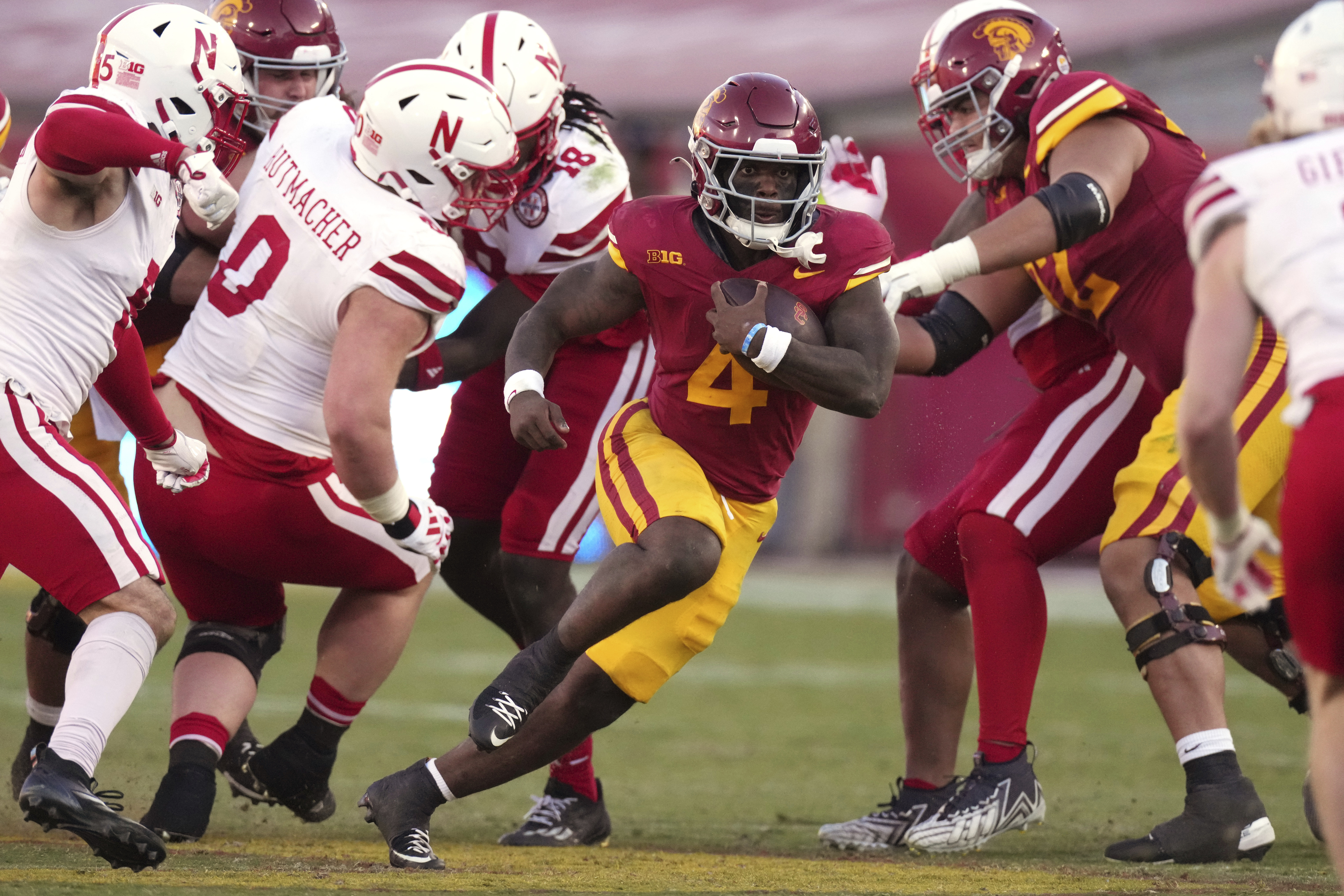 Southern California running back Woody Marks, center, runs the ball during the second half of an NCAA college football game against Nebraska, Saturday, Nov. 16, 2024, in Los Angeles.