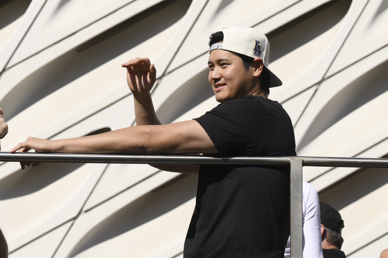 Los Angeles Dodgers' Shohei Ohtani waves at fans during the baseball team's World Series championship parade Friday, Nov. 1, 2024, in Los Angeles.
