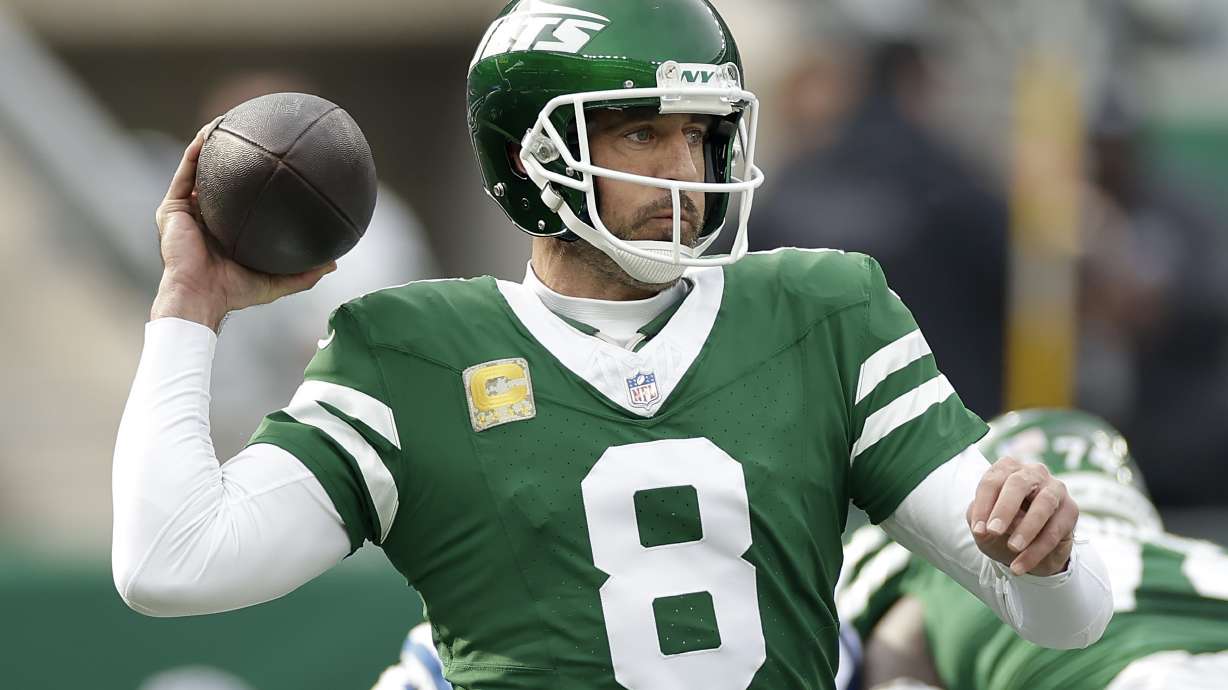 New York Jets quarterback Aaron Rodgers (8) passes against the Indianapolis Colts during the first quarter of an NFL football game, Sunday, Nov. 17, 2024, in East Rutherford, N.J.