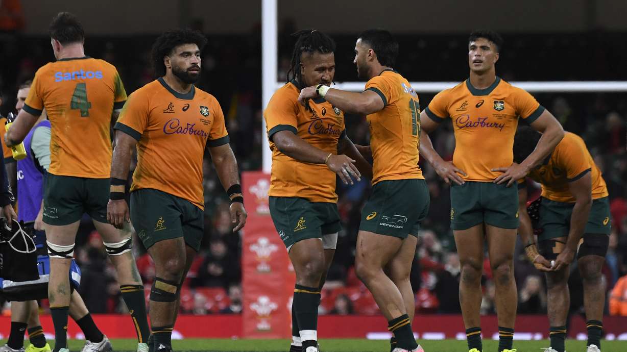 Australian players celebrate winning the Autumn Nations series rugby union match between Wales and Australia at the Principality Stadium in Cardiff, Wales, Sunday, Nov. 17, 2024.