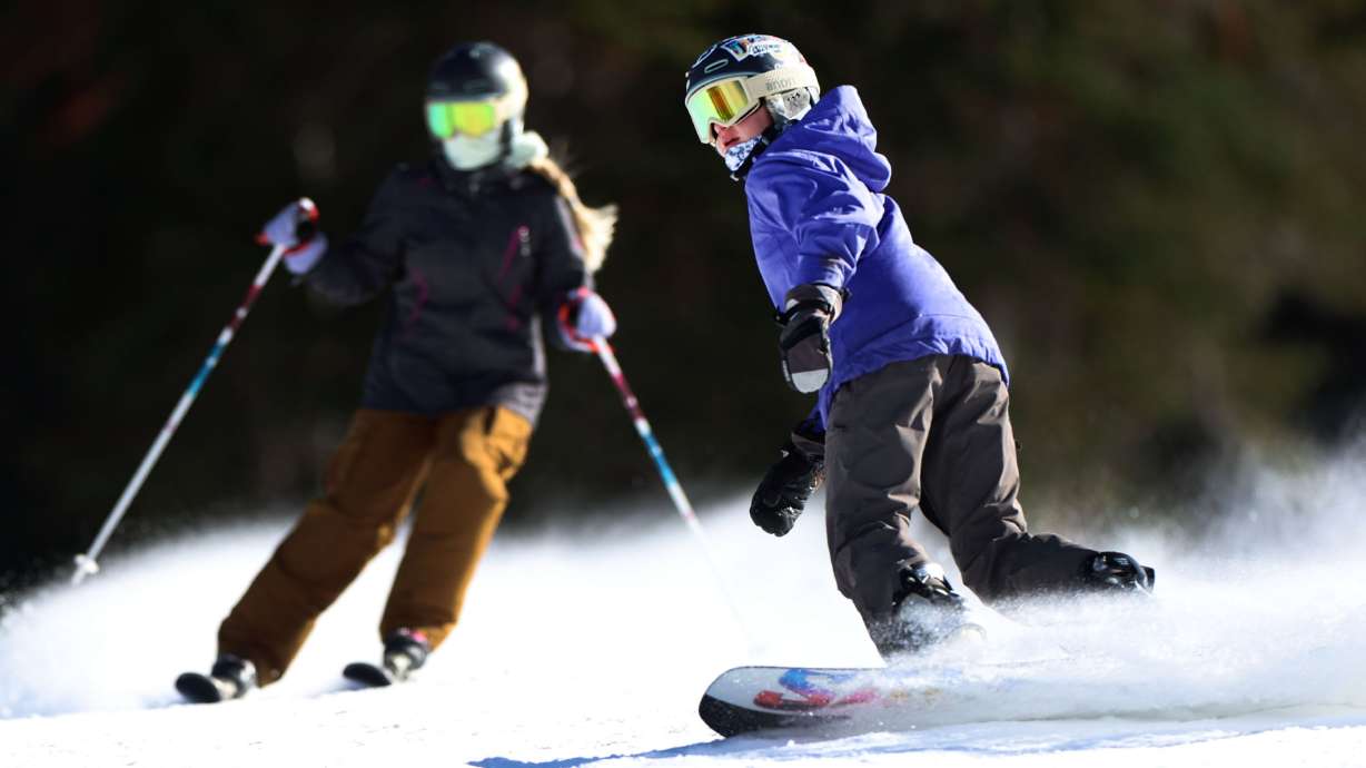 People ski and snowboard at the grand opening of the season at Brighton Resort in Big Cottonwood Canyon on Nov. 14. Snow sports continue to be the largest contributor to Utah's outdoor recreation economy.