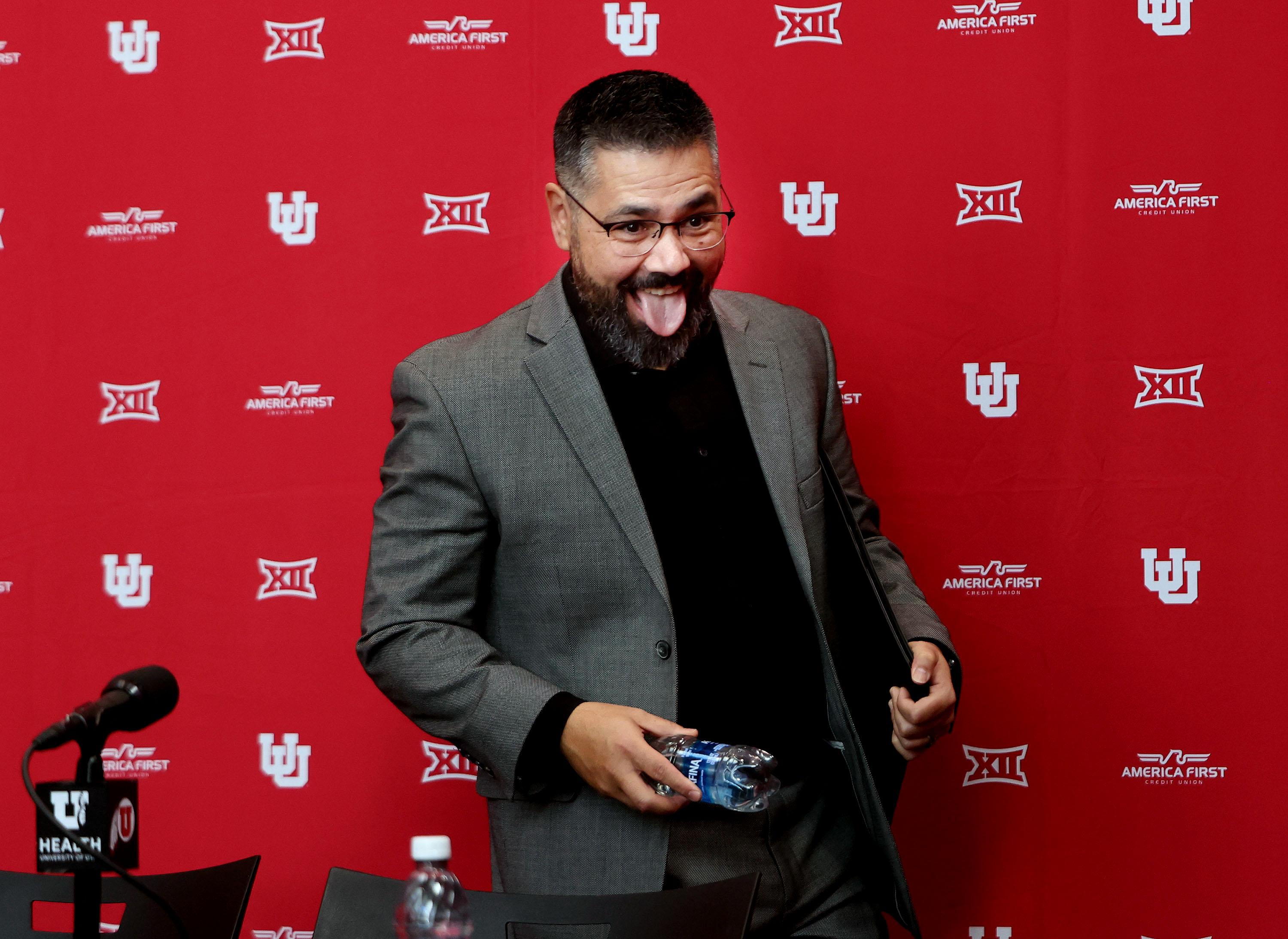 Gavin Peterson makes a funny face to his family as he enters a press conference where he was announced as head coach of the University of Utah’s women’s basketball team in Salt Lake City on Friday, Nov. 22, 2024. Peterson replaces Lynne Roberts, who has accepted the head coaching position for the Los Angeles Sparks of the WNBA.