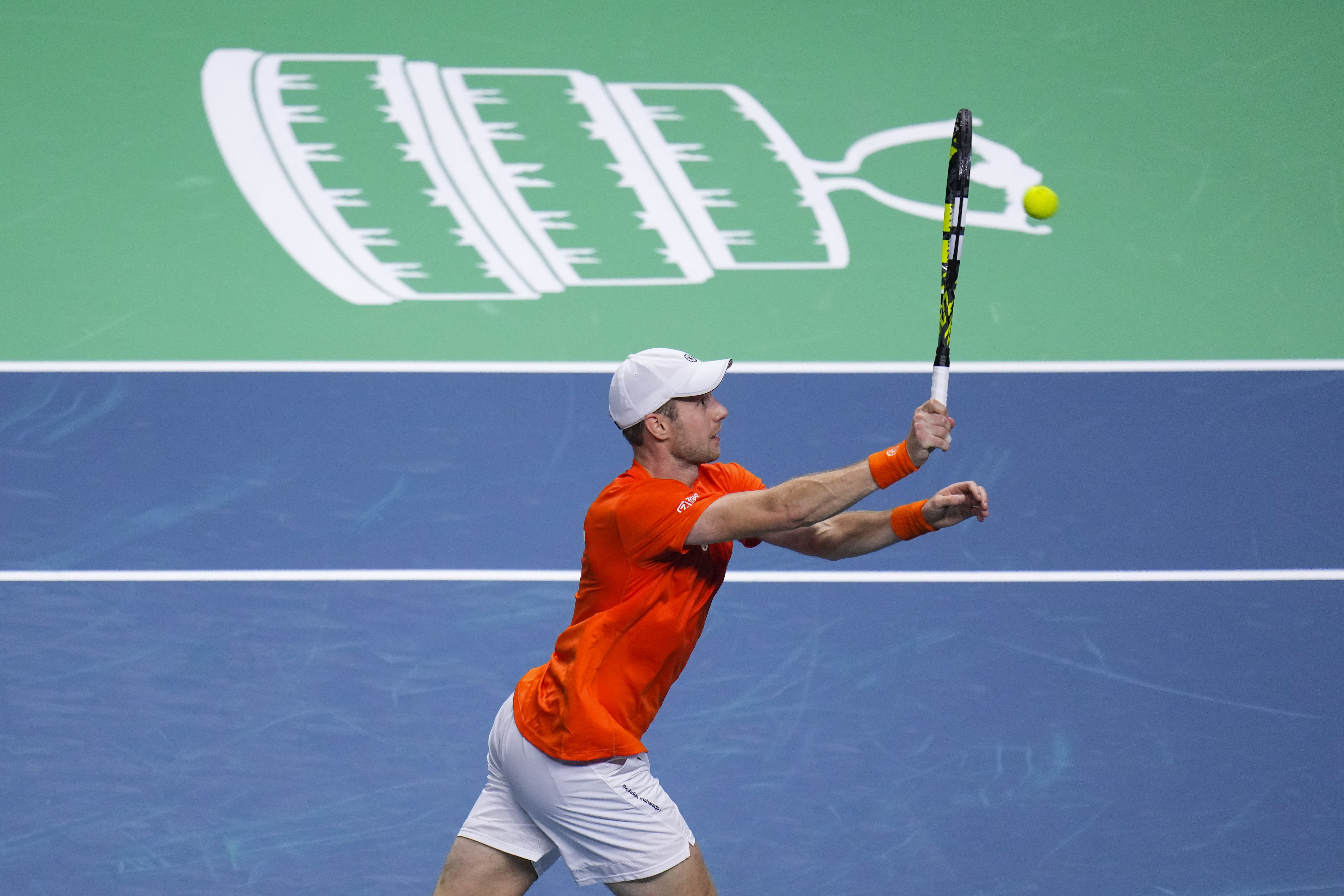 Netherlands' Botic Van De Zandschulp returns the ball to Germany's Jan-Lennard Struff during the Davis Cup semifinal at the Martin Carpena Sports Hall in Malaga, southern Spain, on Friday, Nov. 22, 2024.