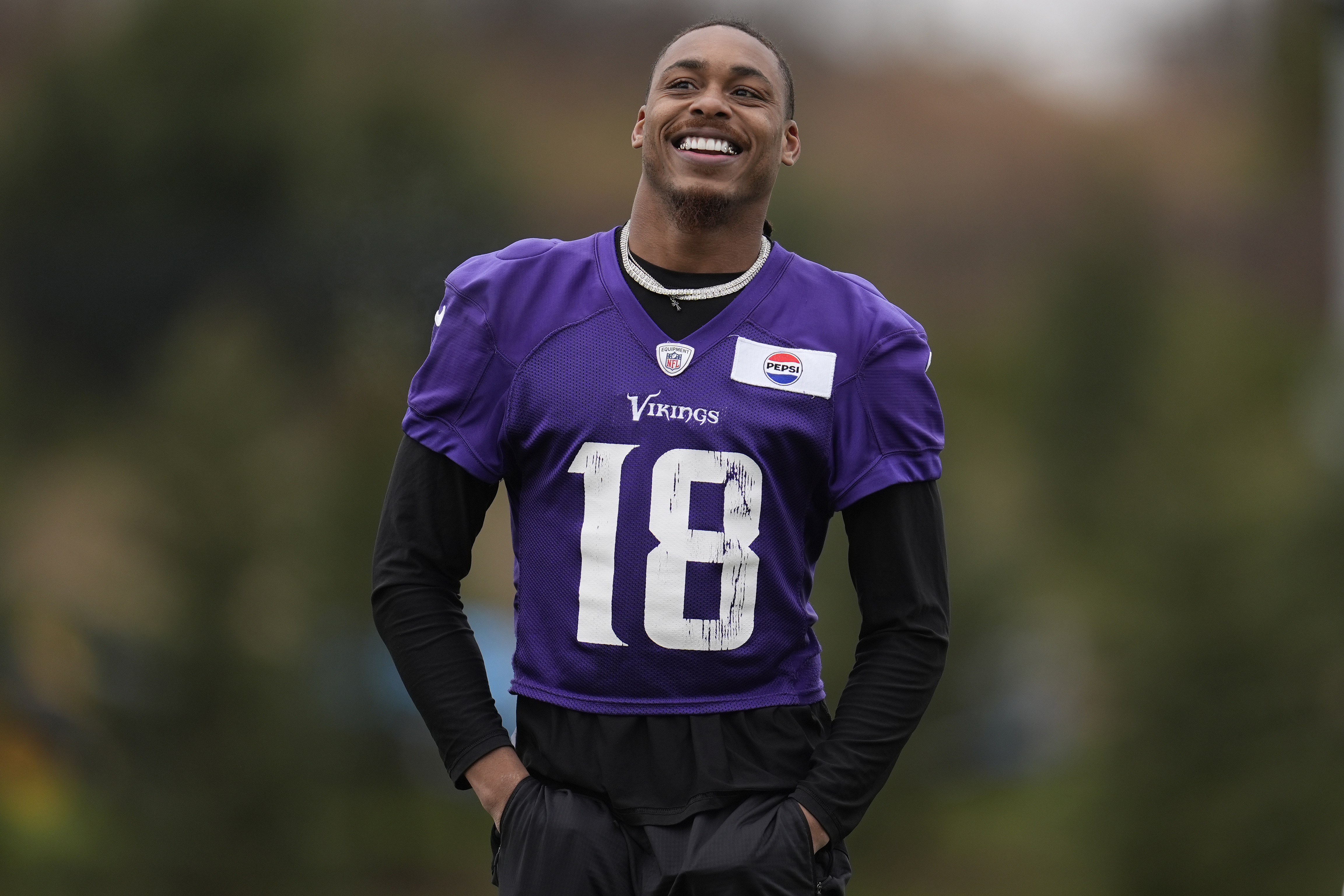 Minnesota Vikings wide receiver Justin Jefferson walks across the field during an NFL football team practice in Eagan, Minn., Friday, Nov. 22, 2024. 