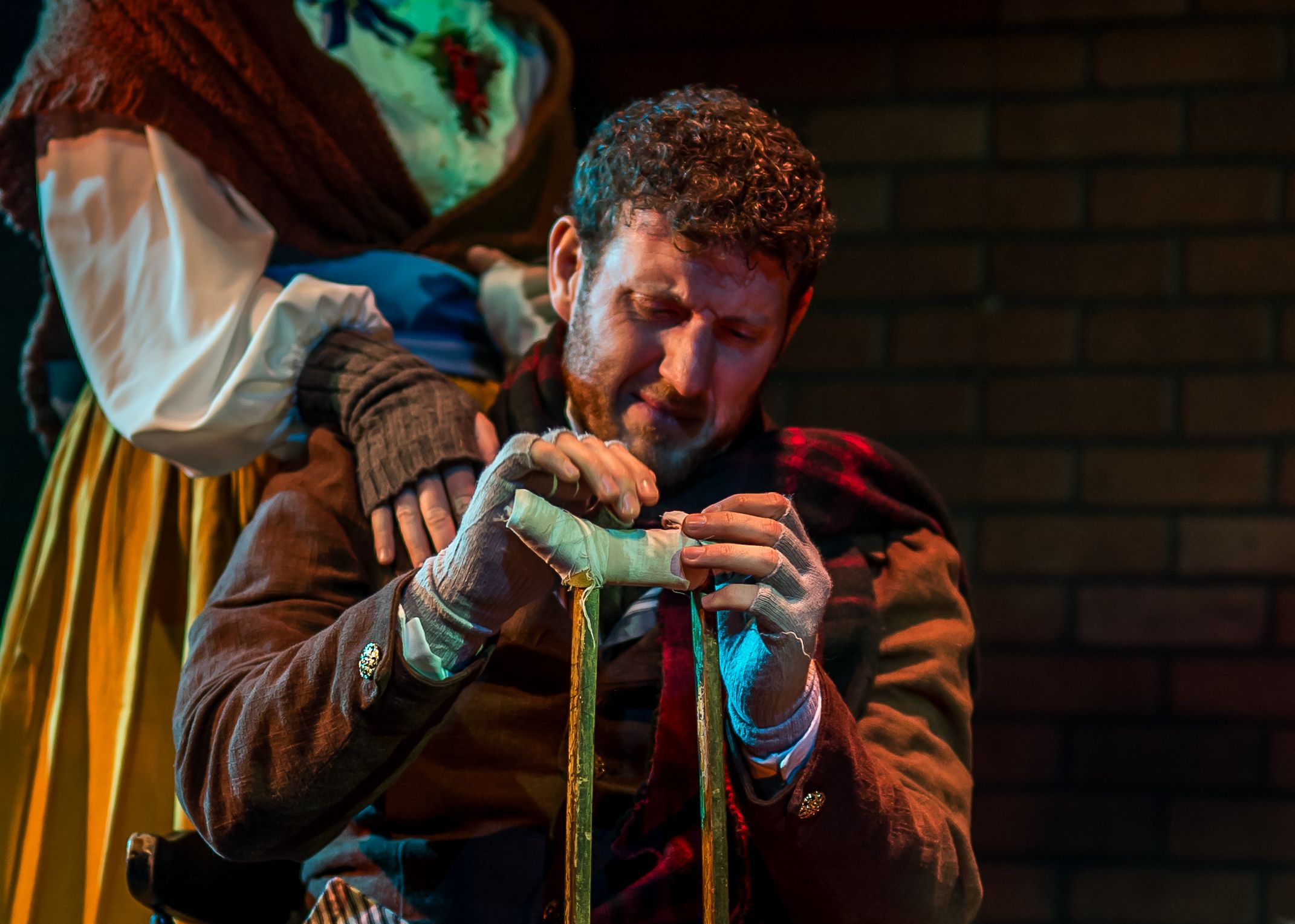 Lucas Charon performs as Bob Cratchit in "A Christmas Carol" at the Parker Theatre in Salt Lake City on Nov. 20.