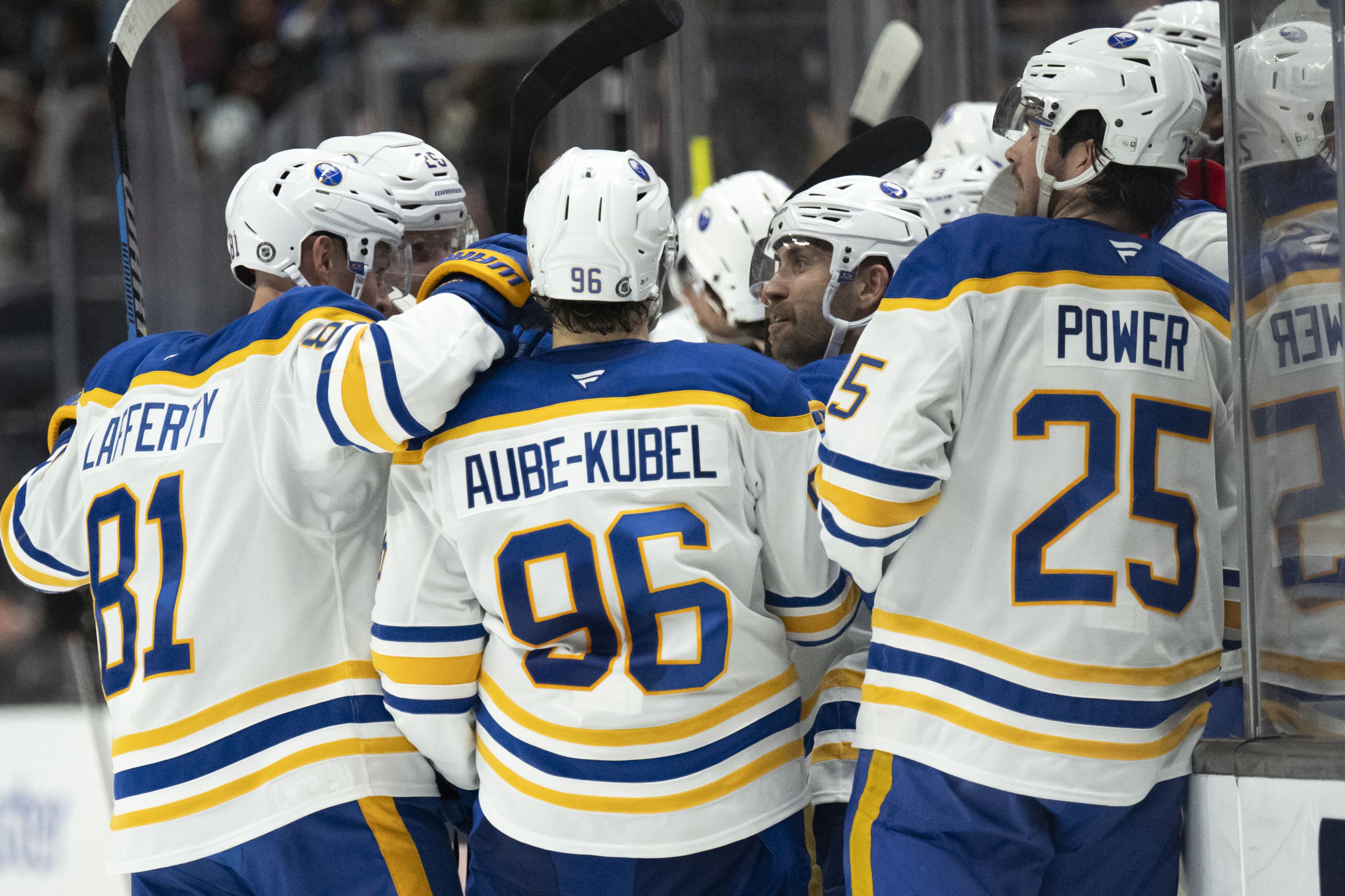 Buffalo Sabres players celebrate a goal by left wing Jason Zucker (17) during the second period of an NHL hockey game against the Anaheim Ducks, Friday, Nov. 22, 2024, in Anaheim, Calif.