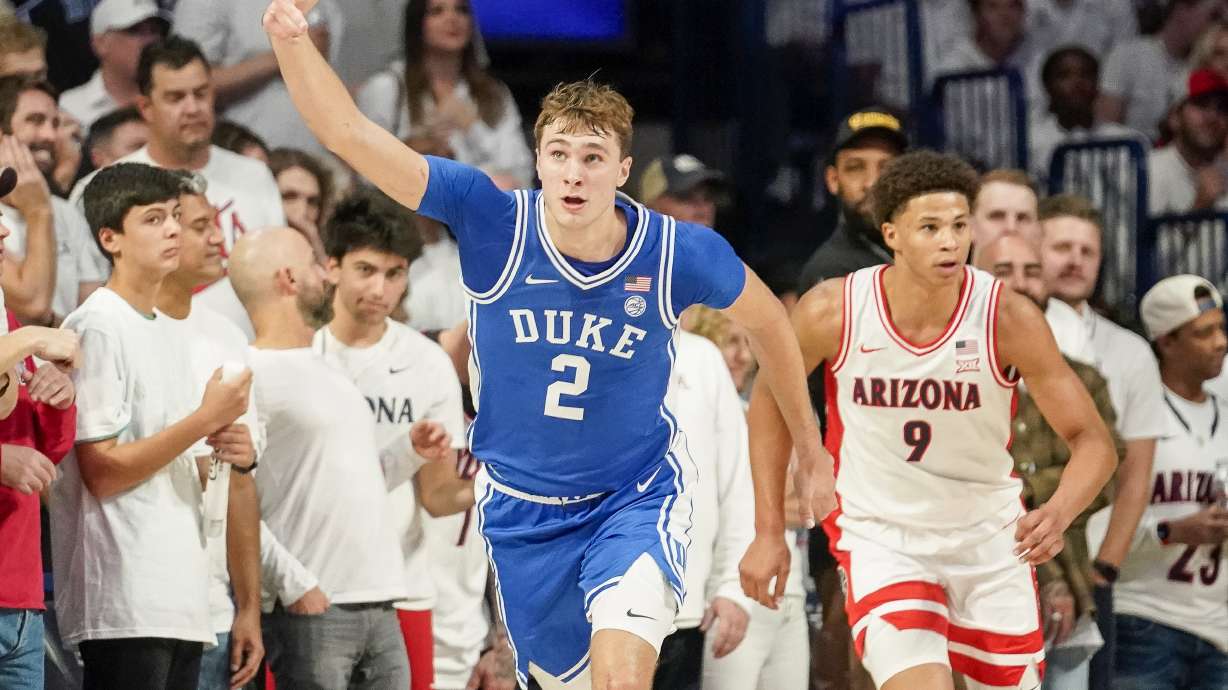 Duke guard Cooper Flagg (2) gestures after hitting a 3-point shot against Arizona during the second half of an NCAA college basketball game Friday, Nov. 22, 2024, in Tucson, Ariz.