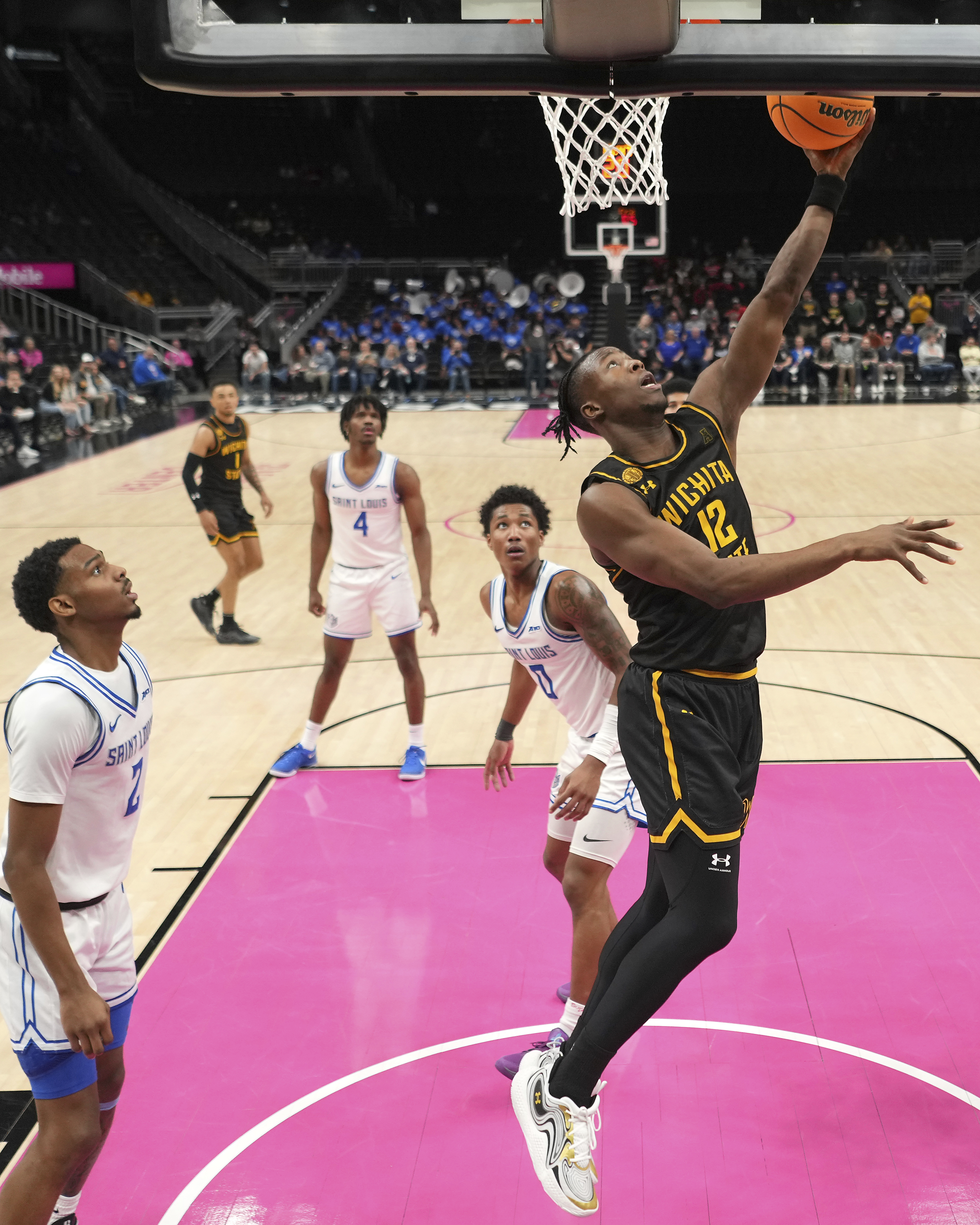 Wichita State guard Joy Ighovodja (12) puts up a shot during the second half of an NCAA college basketball game against Saint Louis, Friday, Nov. 22, 2024, in Kansas City, Mo.