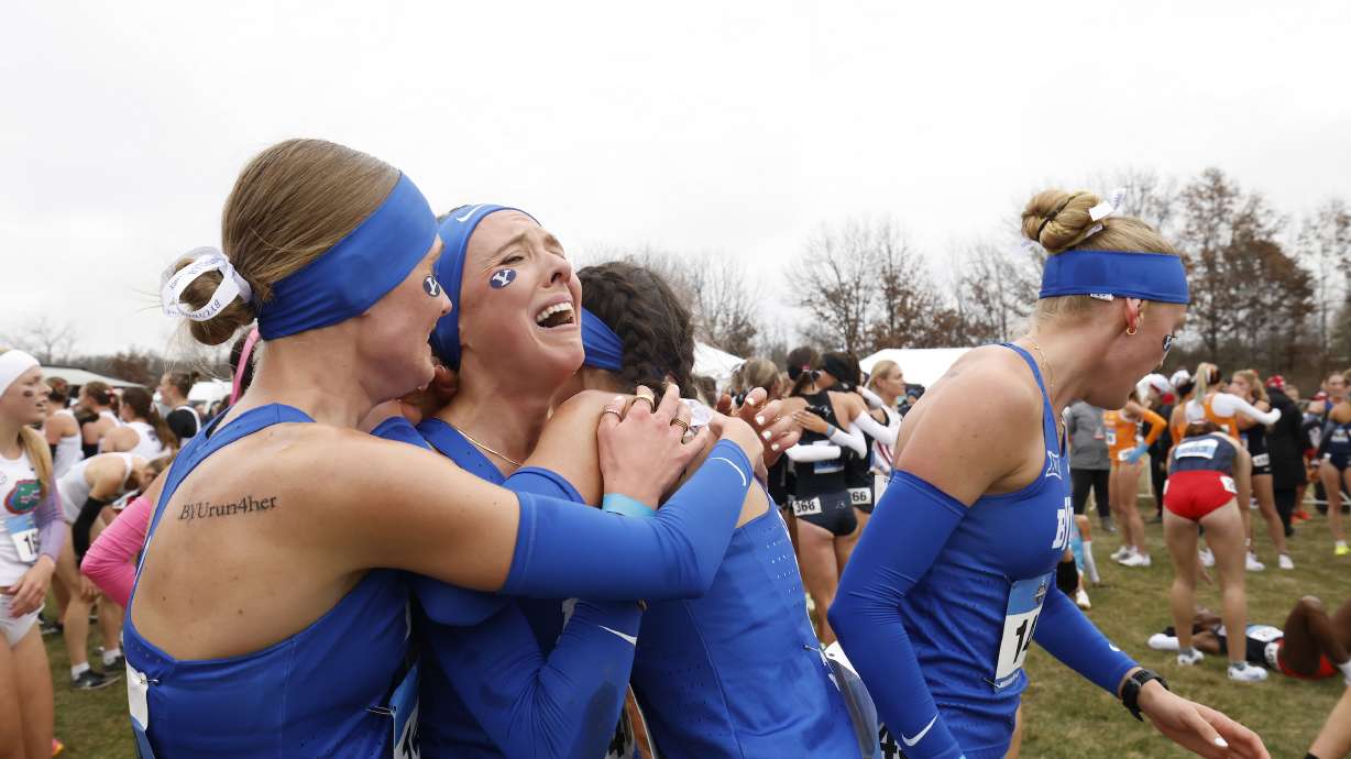 BYU's Lexy Halladay-Lowry lets out the emotion with her teammates after the top-ranked Cougars' women's cross country team won its sixth national championship, Saturday, Nov. 23, 2024 in Madison, Wisconsin.