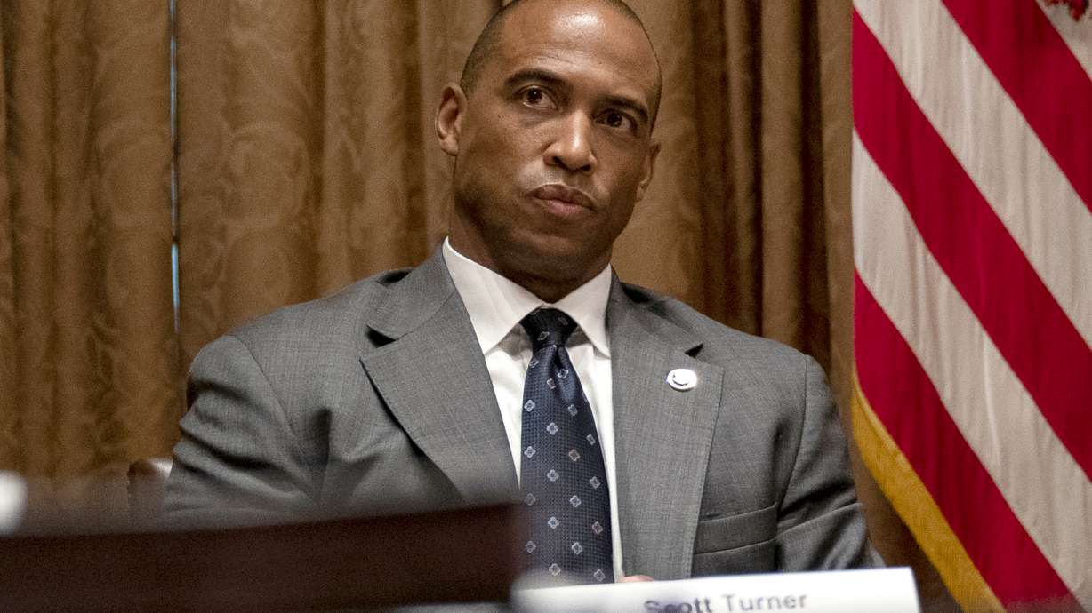 FILE - Scott Turner, the executive director of the White House Opportunity and Revitalization Council, attends a meeting in the Cabinet Room of the White House, May 18, 2020, in Washington.