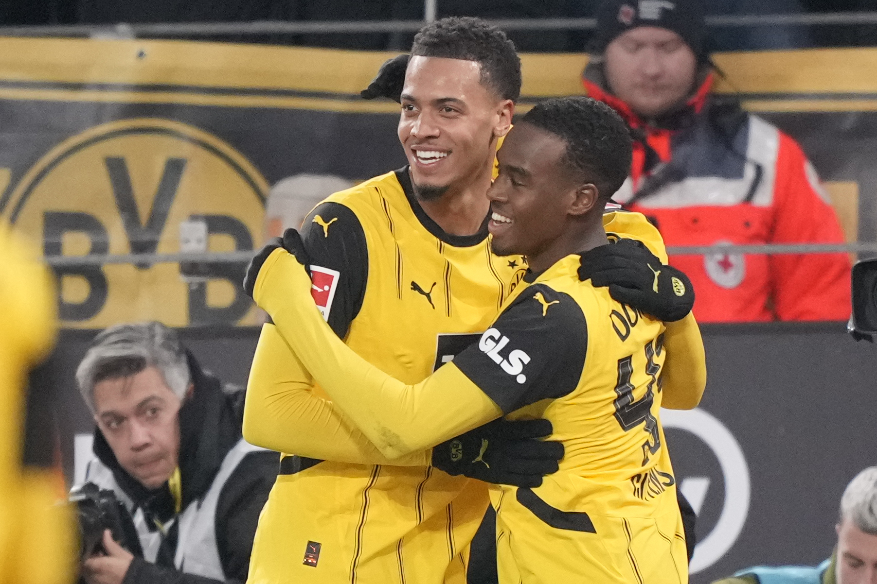 Dortmund's Jamie Bynoe-Gittens, right, celebrates after scoring with his teammate Felix Nmecha during the German Bundesliga soccer match between Borussia Dortmund and SC Freiburg at the Signal-Iduna Park in Dortmund, Germany, Saturday, Nov. 23, 2024. 