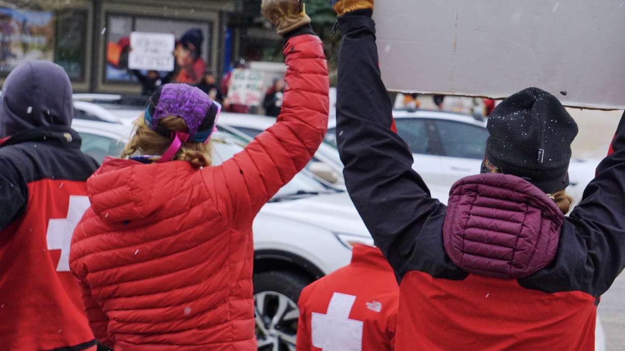 Ski patrollers demonstrate Saturday in Park City after monthslong union negotiations with Vail Resorts reached a standstill.