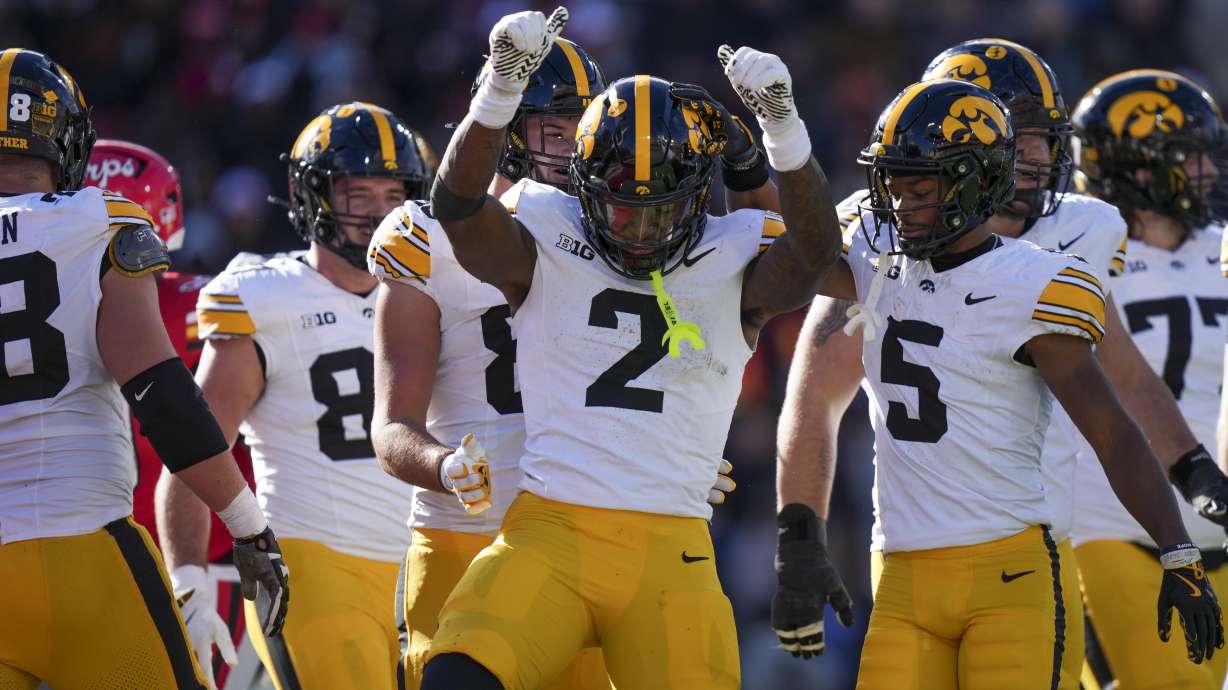 Iowa running back Kaleb Johnson (2) dances while celebrating his touchdown during the first half of an NCAA college football game against Maryland, Saturday, Nov. 23, 2024, in College Park, Md.