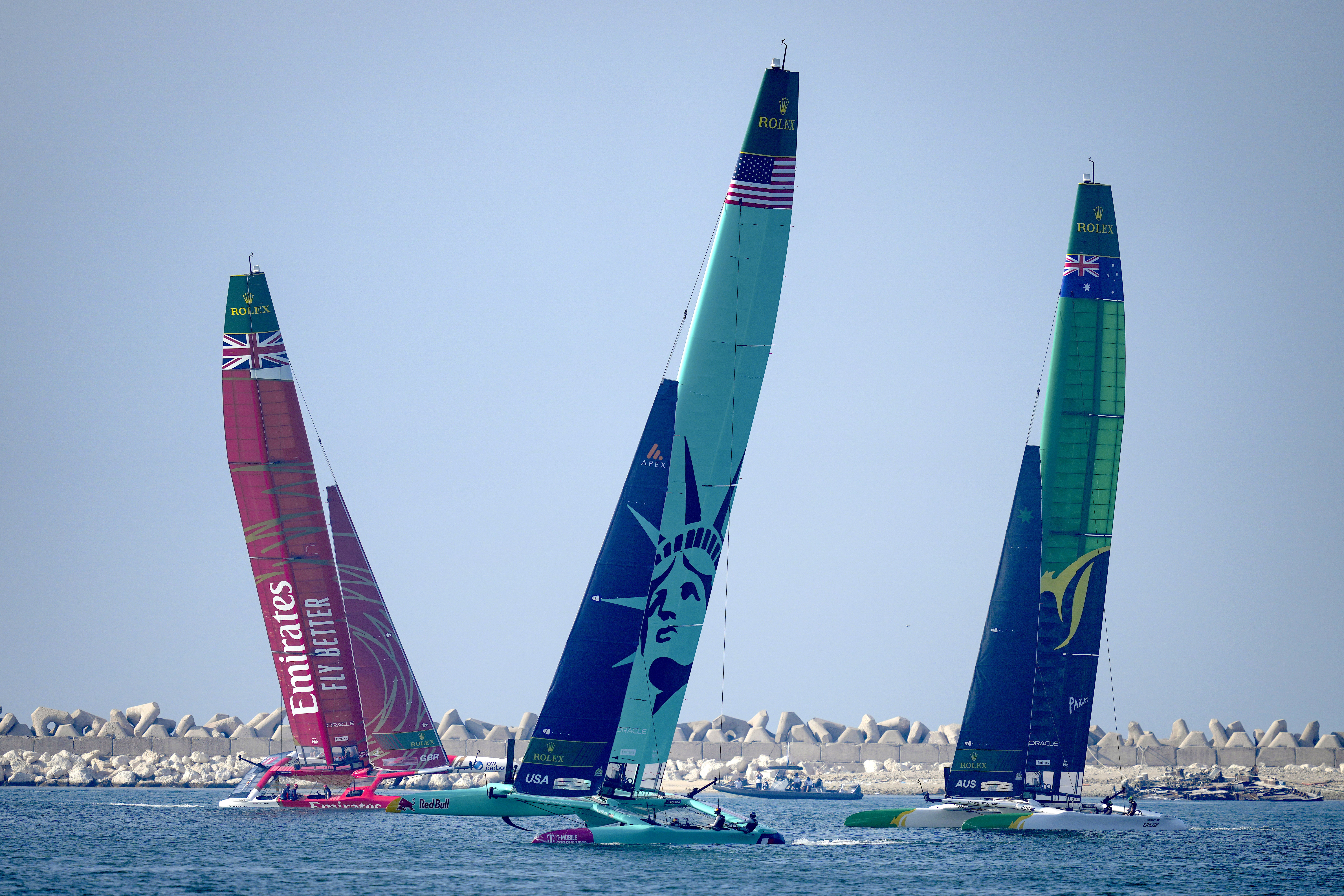 Emirates Great Britain SailGP Team, left, United States SailGP Team, centre, and Australia SailGP Team compete during the Dubai Sail Grand Prix Race, in Dubai, United Arab Emirates, Saturday, Nov. 23, 2024.