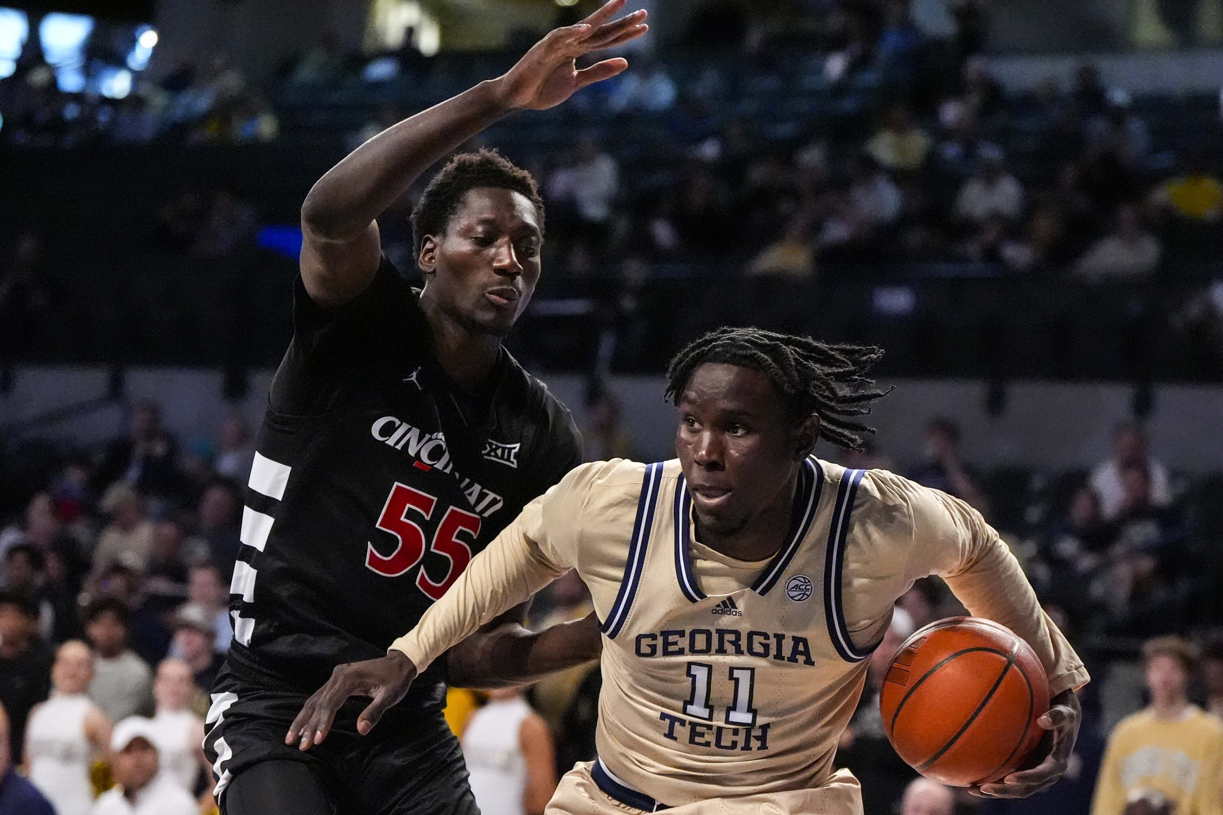 Georgia Tech forward Baye Ndongo (11) moves against Cincinnati forward Aziz Bandaogo (55) during the first half of an NCAA basketball game, Saturday, Nov. 23, 2024, in Atlanta. 