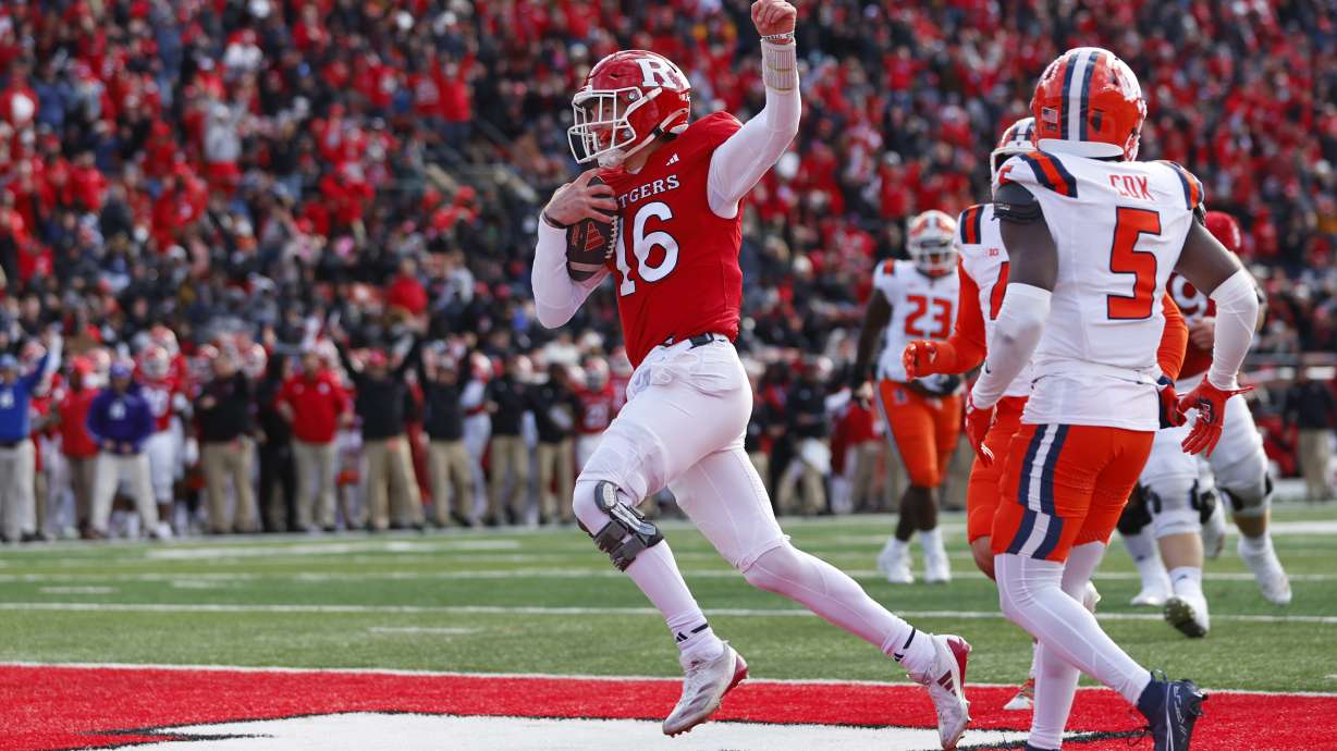Rutgers quarterback Athan Kaliakmanis (16) gestures after running for a touchdown against the Illinois during the first half of an NCAA college football game Saturday, Nov. 23, 2024, in Piscataway, N.J.