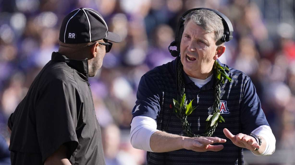 Arizona head coach Brent Brennan, right, makes a point with an official during the first half of an NCAA college football game against TCU, Saturday, Nov. 23, 2024, in Fort Worth, Texas.