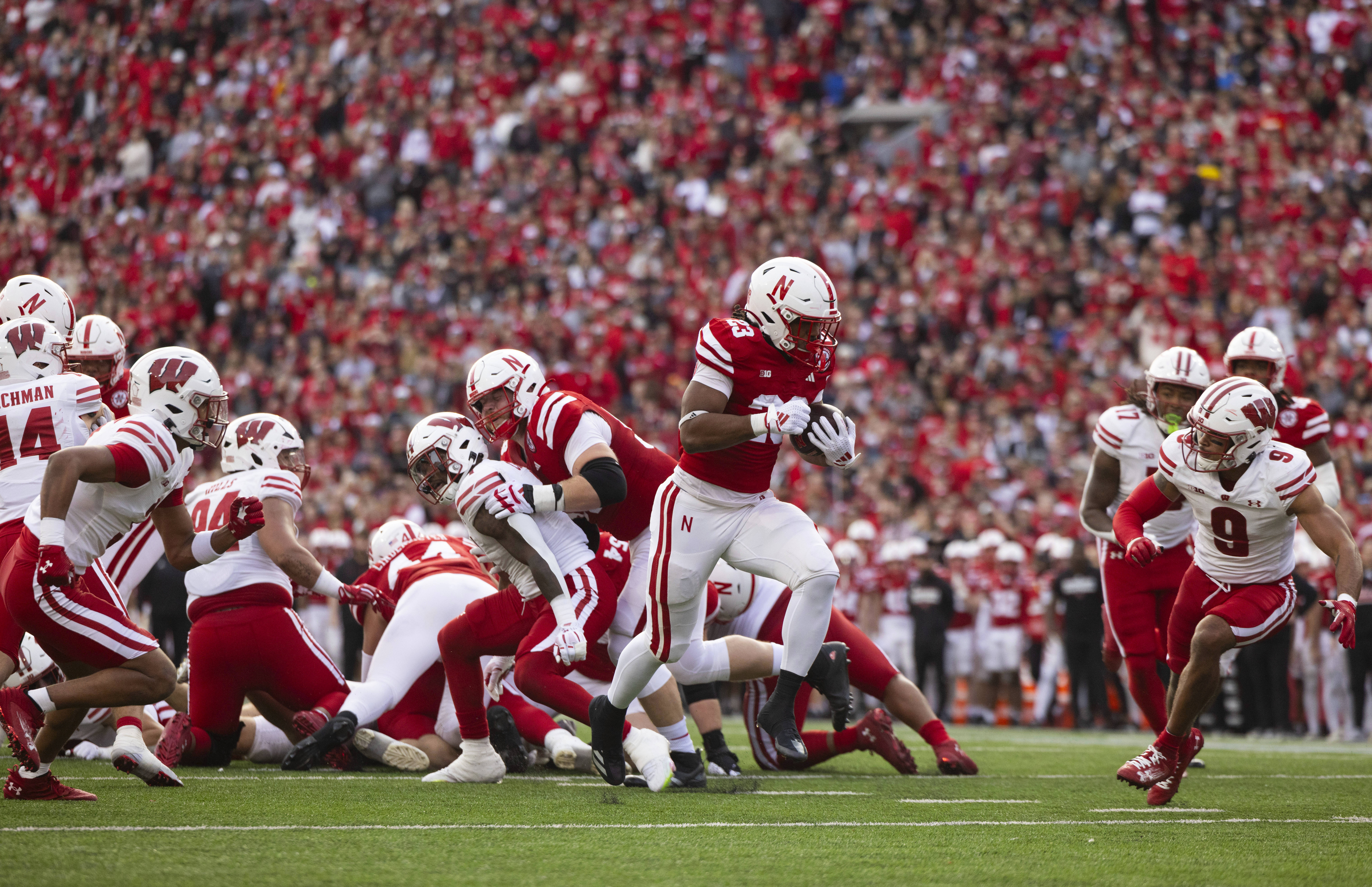 Nebraska's Dante Dowdell (23) breaks through the Wisconsin defense to score a touchdown during the first half of an NCAA college football game Saturday, Nov. 23, 2024, in Lincoln, Neb. 
