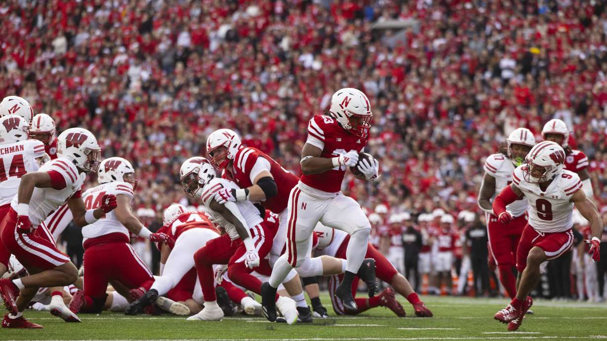 Nebraska's Dante Dowdell (23) breaks through the Wisconsin defense to score a touchdown during the first half of an NCAA college football game Saturday, Nov. 23, 2024, in Lincoln, Neb.
