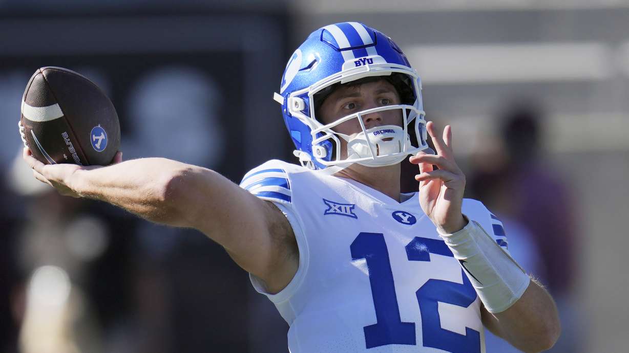 BYU quarterback Jake Retzlaff warms up prior to an NCAA college football game against Arizona State, Saturday, Nov. 23, 2024, in Tempe, Ariz.