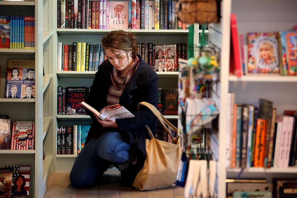 Katherine Anne Thierfelder looks at a book at Folklore Bookshop in Midway on Nov. 6.