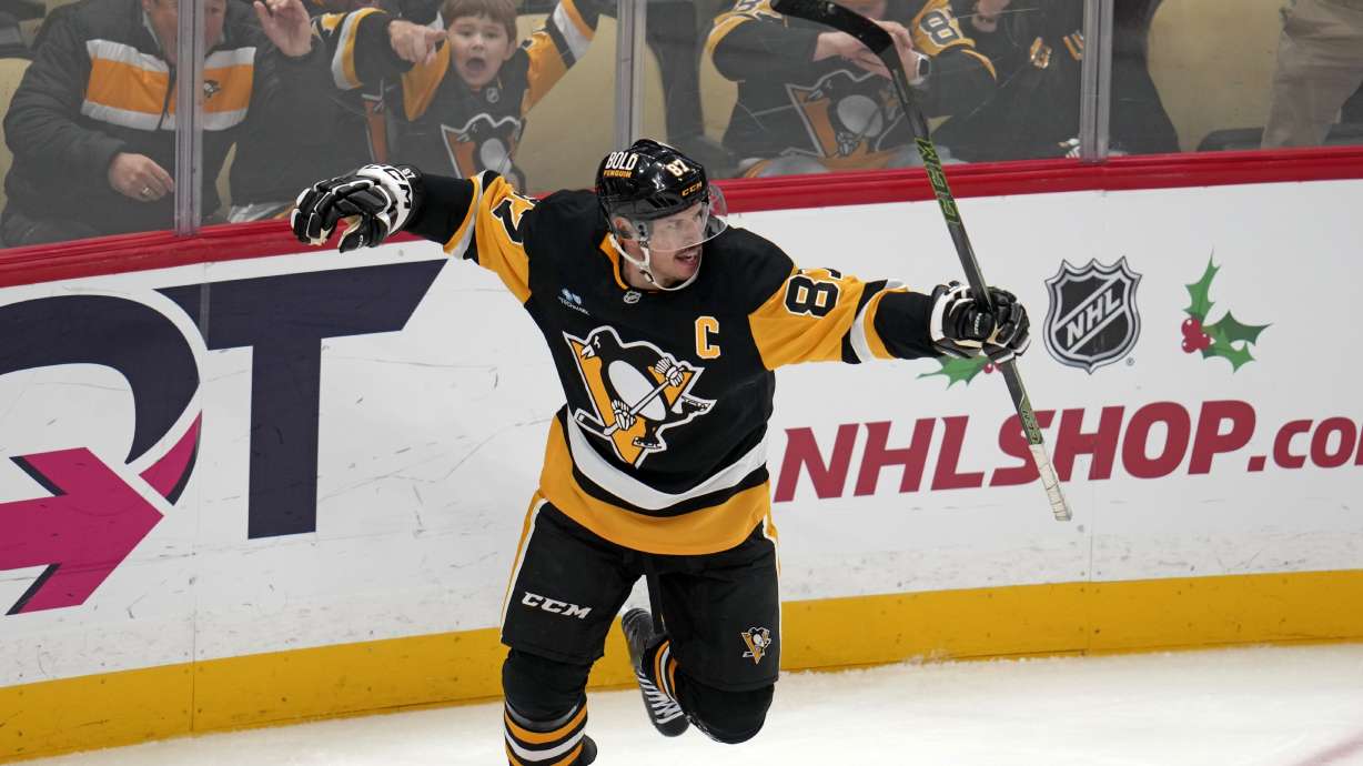 Pittsburgh Penguins' Sidney Crosby (87) celebrates after getting his 600th career goal in the NHL during the second period of an NHL hockey game against the Utah Hockey Club, Saturday, Nov. 23, 2024, in Pittsburgh.