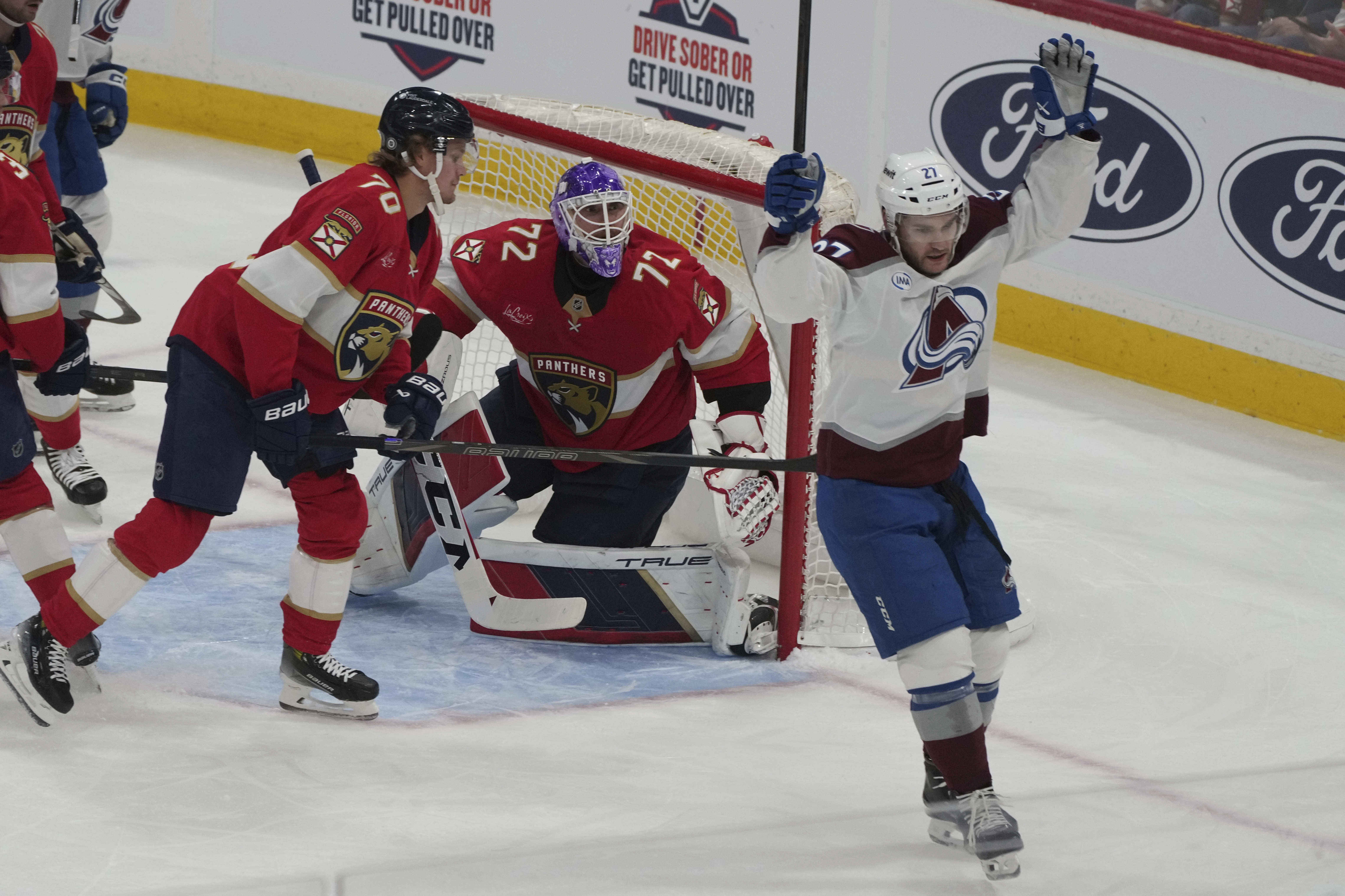 Colorado Avalanche left wing Jonathan Drouin (27) reacts after scoring a goal during the first period of an NHL hockey game against the Florida Panthers, Saturday, Nov. 23, 2024, in Sunrise, Fla.