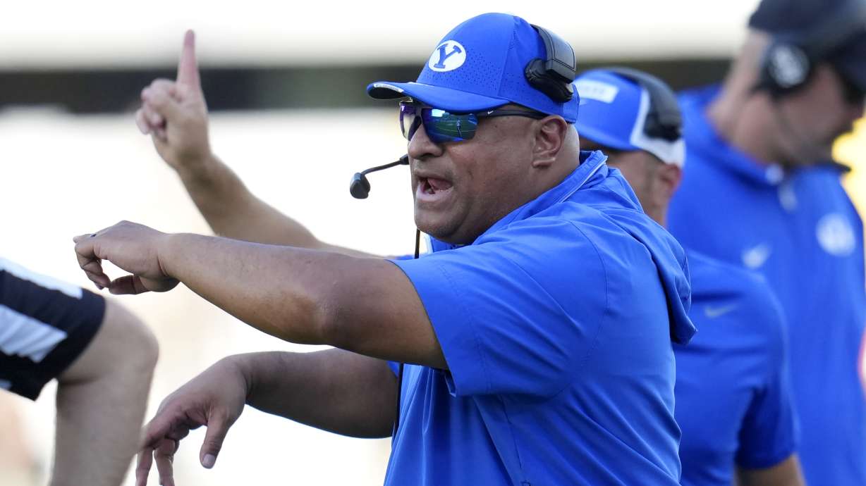 BYU head coach Kalani Sitake shouts instructions during the second half of an NCAA college football game against Arizona State Saturday, Nov. 23, 2024, in Tempe, Ariz. Arizona State won 28-23.